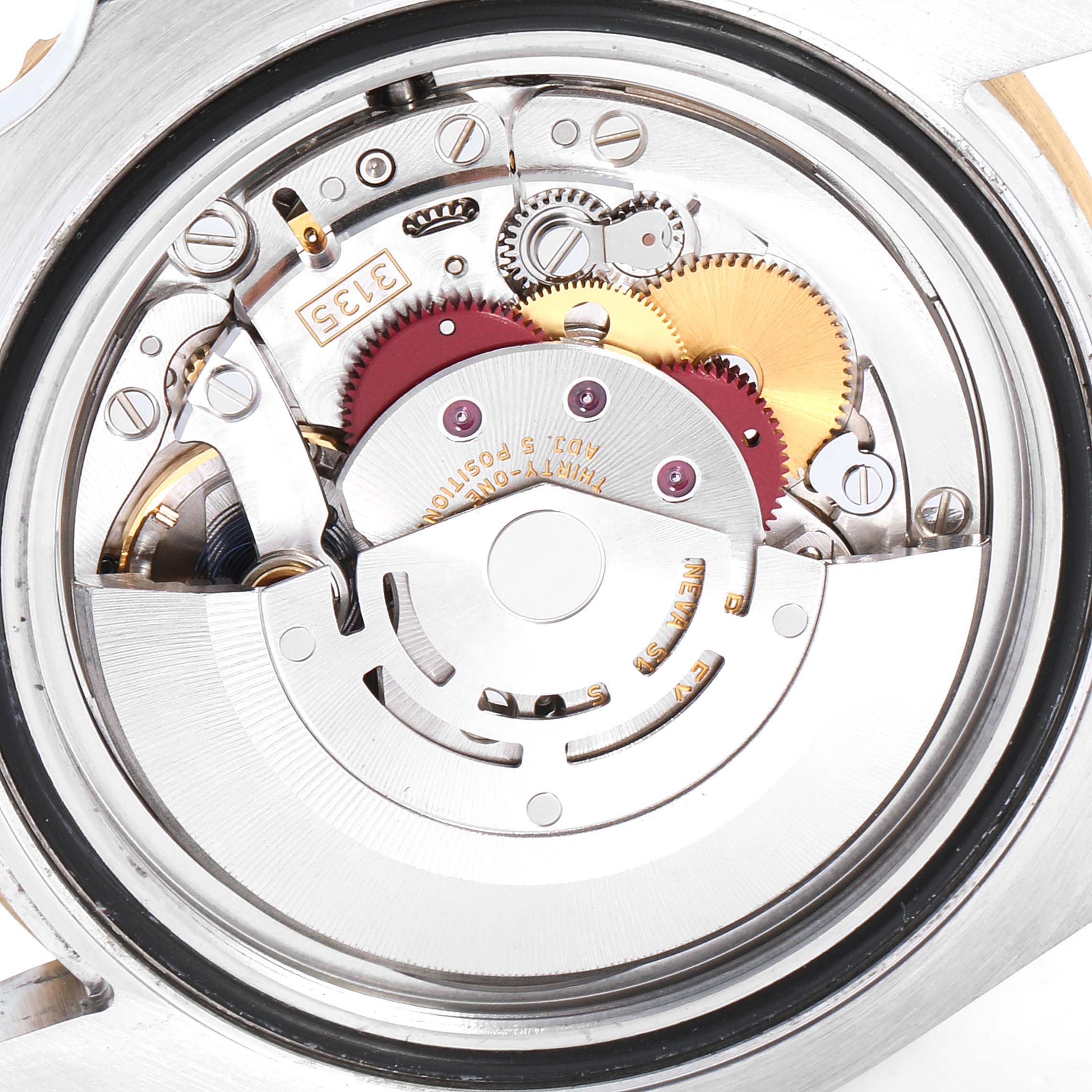 This image shows the internal movement mechanics of a Rolex Submariner 116613 Men's Steel and Gold (two tone) Black Dial 116613 Men's Steel and Gold (two tone) Black Dial watch, taken from the back.