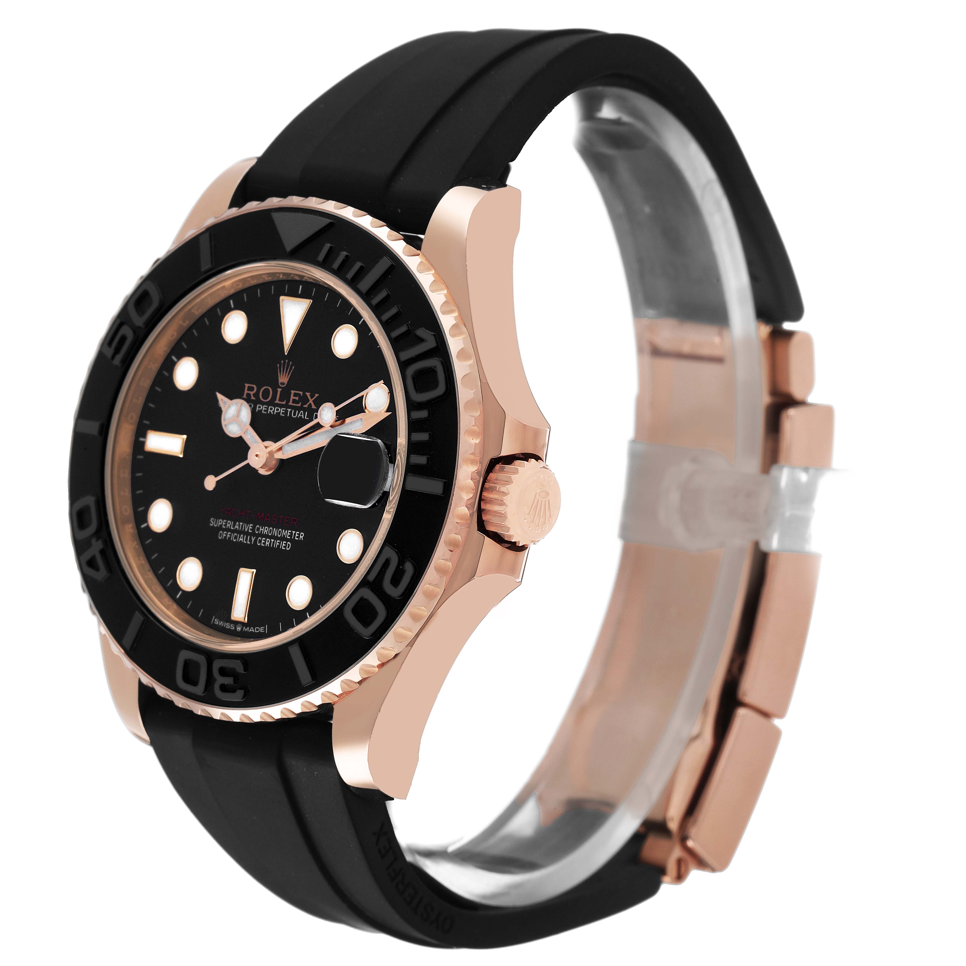 The Rolex Yacht-Master 268655 Men's Rose Gold Black Dial watch is shown at a three-quarter angle, highlighting its black dial, rose gold case, and rubber strap.