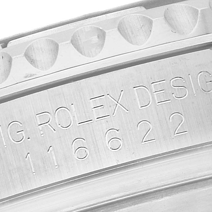This close-up image shows the engraved serial number and part of the bezel of a Rolex Yacht-Master 116622 Men
s Stainless Steel Blue Dial 116622 Men
s Stainless Steel Blue Dial watch.