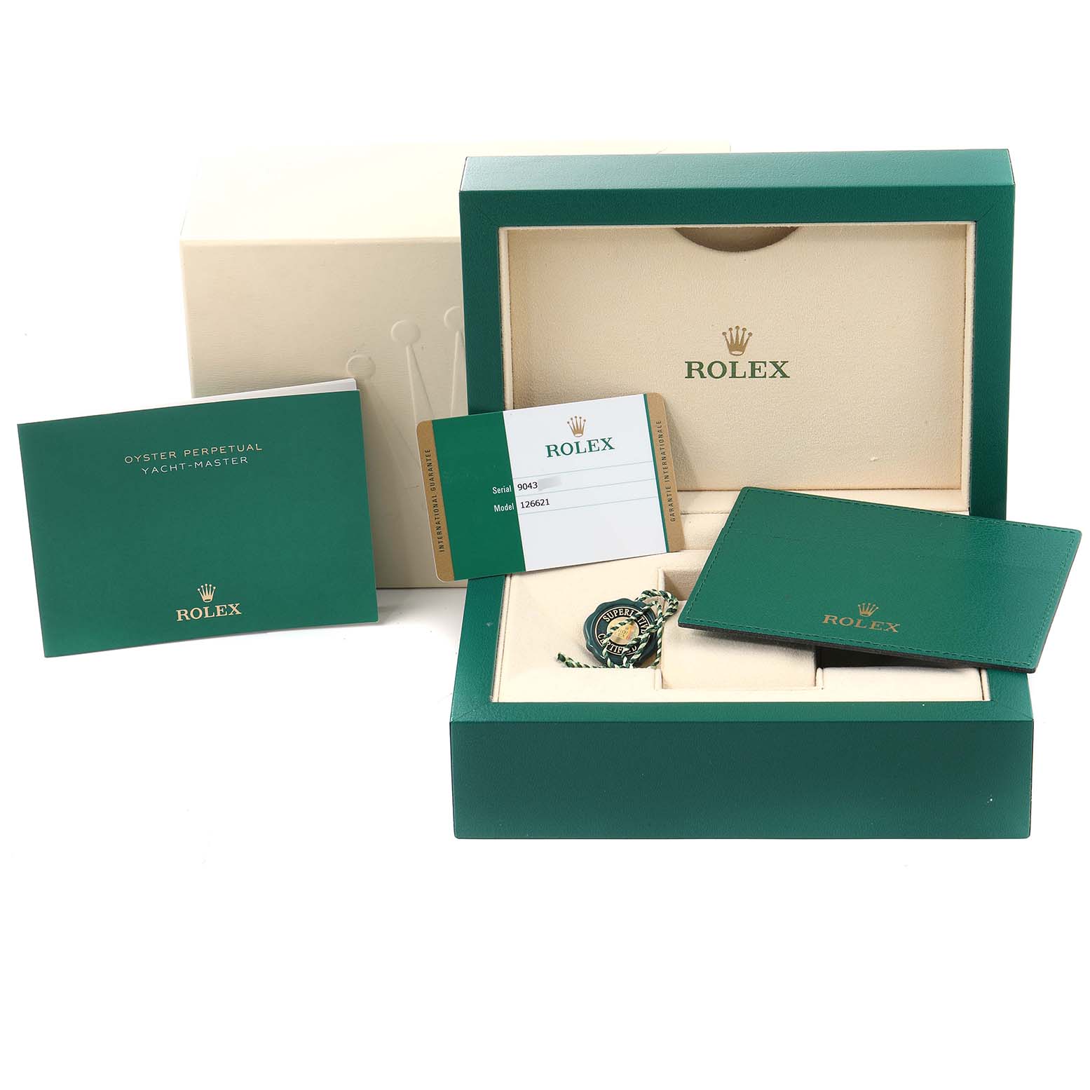 This image shows the packaging and accessories of a Rolex Yacht-Master 126621 Men's Steel and Gold (two tone) Brown Dial 126621 Men's Steel and Gold (two tone) Brown Dial watch, including manuals, a warranty card, and a presentation box.