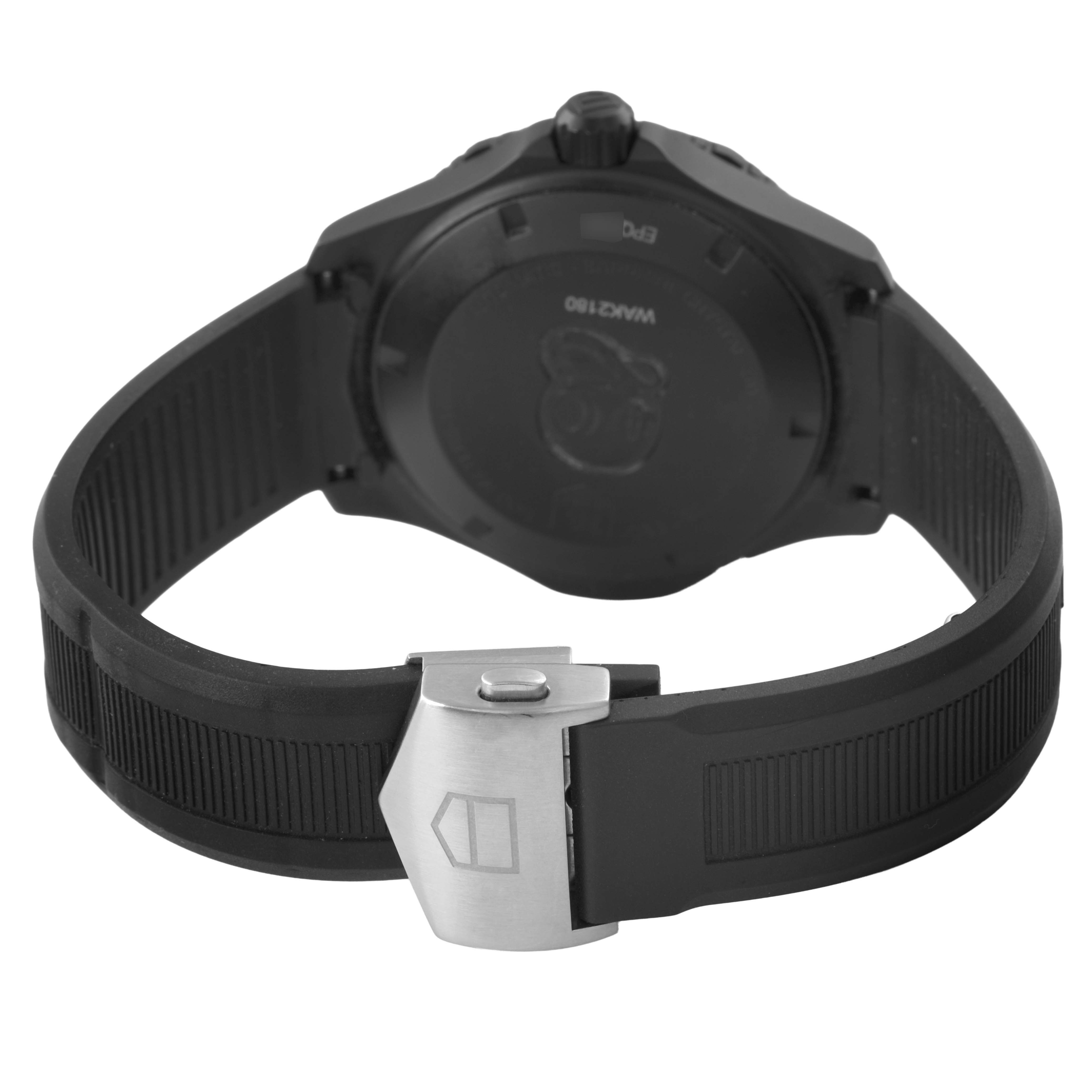 The image shows the back of the Tag Heuer Aquaracer WAK2180.FT6027 Men's Titanium Black Dial watch, highlighting its clasp and rubber strap.