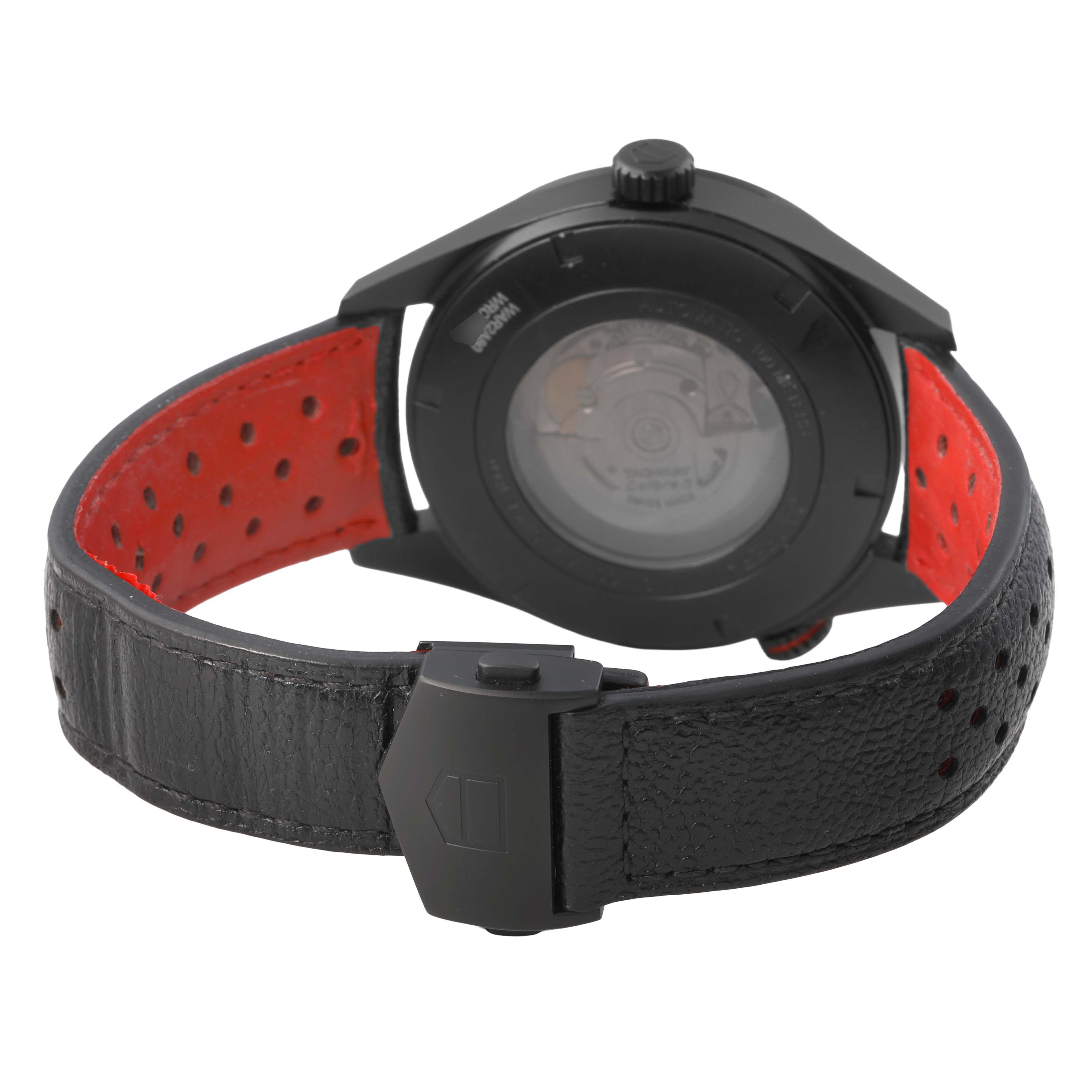 The image shows the back case and strap of a Tag Heuer Carrera WAR2A80.FC6337 Men's Titanium Black Dial watch, highlighting its clasp and red interior lining.