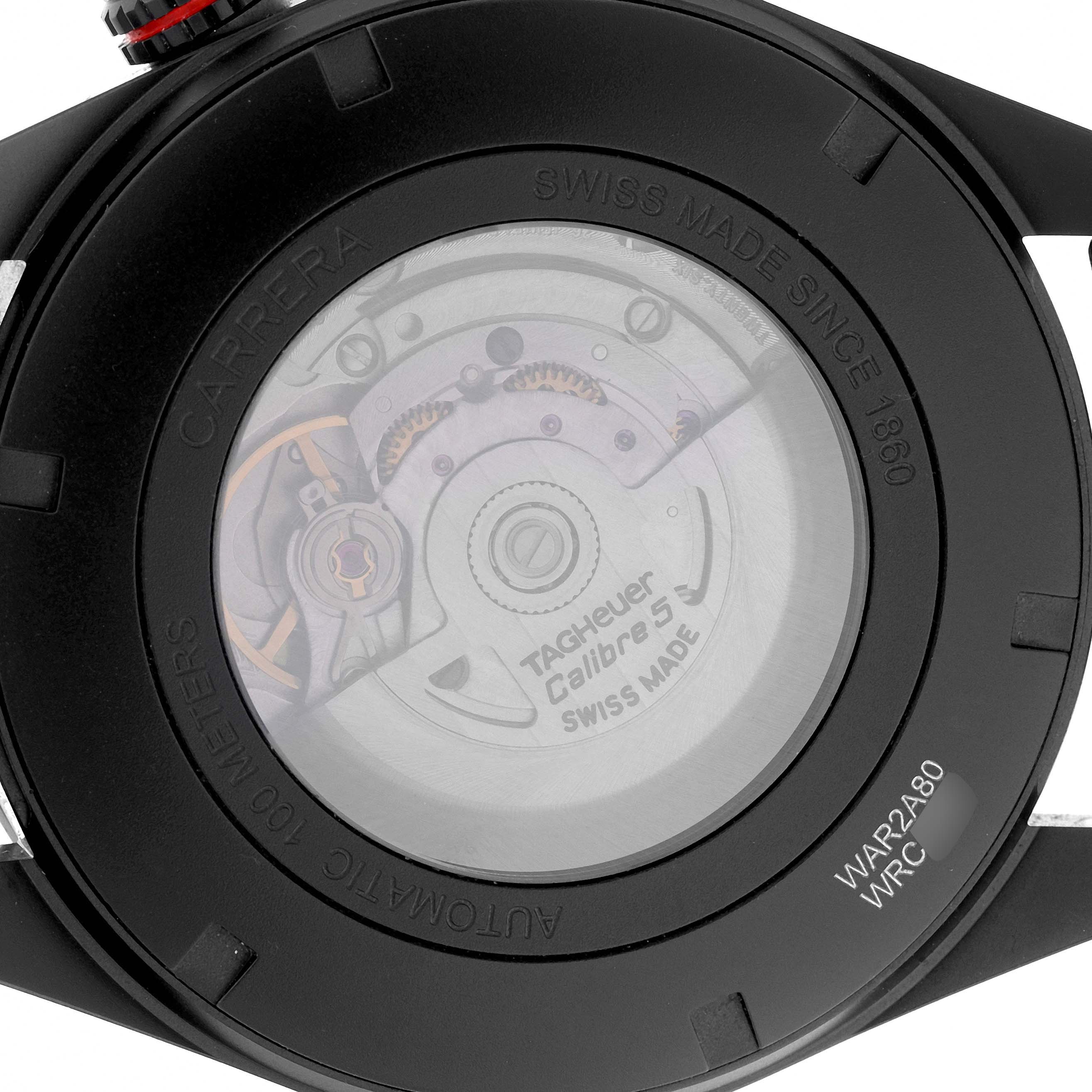 The image shows the back of a Tag Heuer Carrera WAR2A80.FC6337 Men's Titanium Black Dial watch, highlighting the automatic movement and "Calibre 5" inscription.
