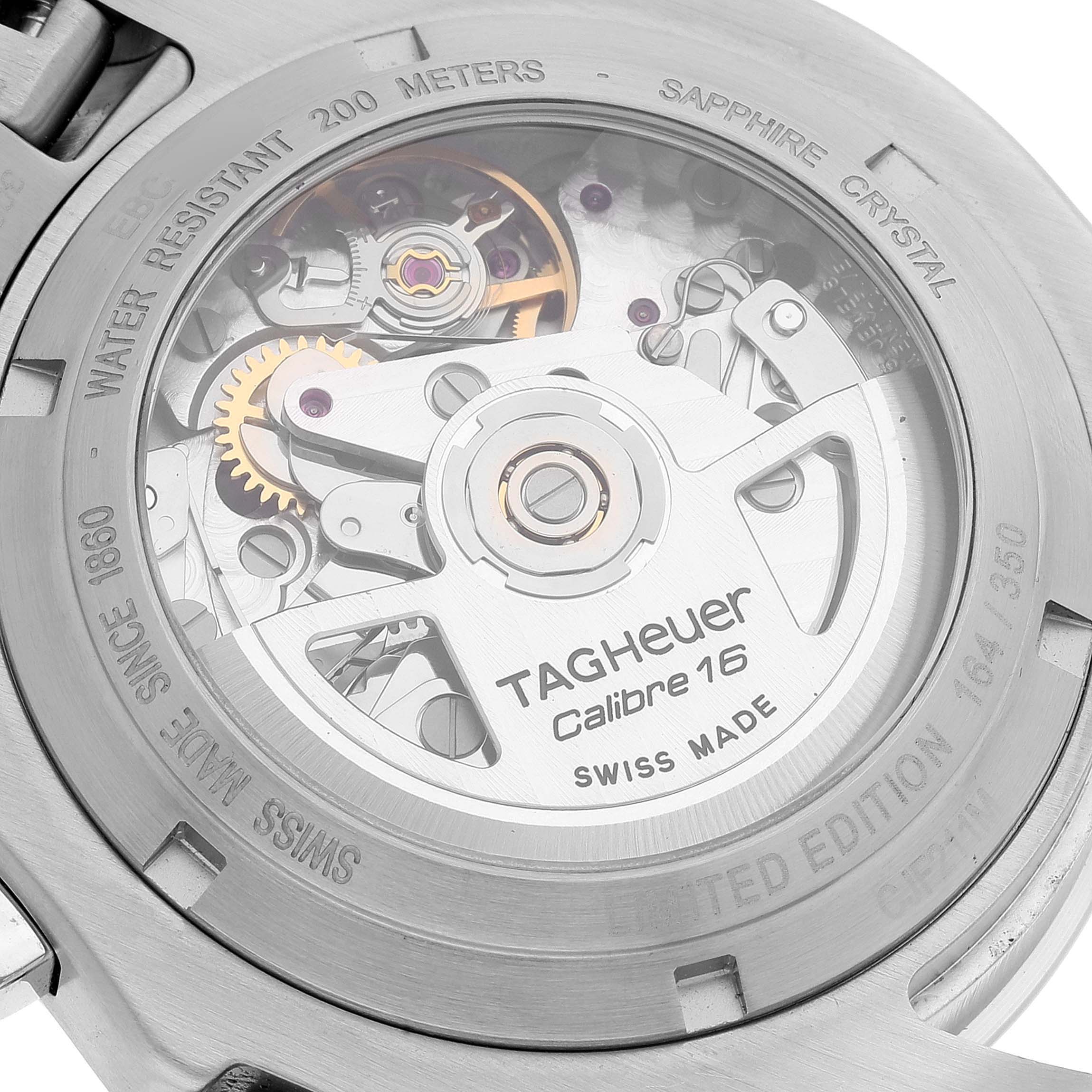 This image shows the rear case of a Tag Heuer Link watch, highlighting its internal mechanism and engravings.