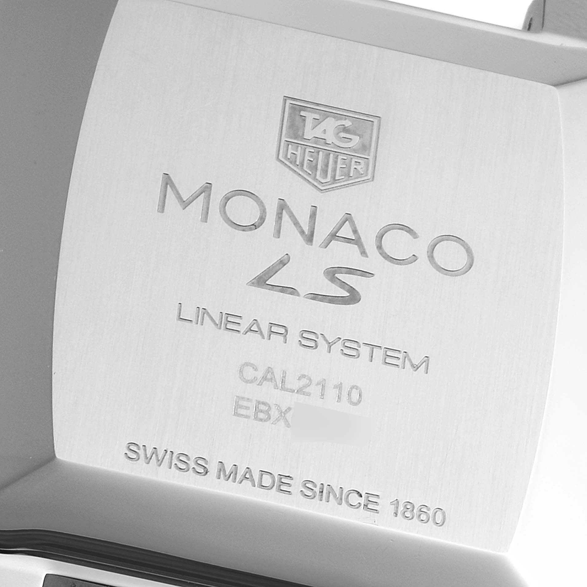 The image shows the engraved back plate of the Tag Heuer Monaco CAL2110.FC6257 Men's Stainless Steel Black Dial CAL2110.FC6257 Men's Stainless Steel Black Dial Linear System watch at a slightly angled view.