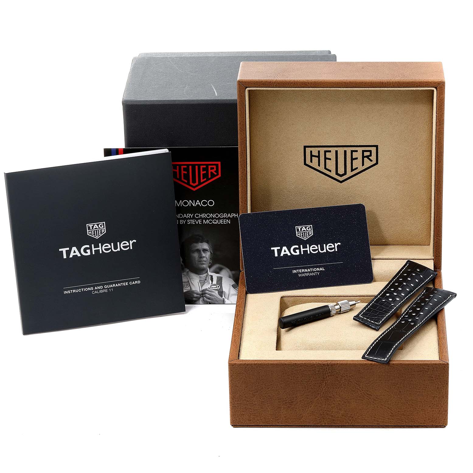 The image shows a Tag Heuer Monaco CAW211P Men's Stainless Steel Blue Dial CAW211P Men's Stainless Steel Blue Dial watch box, extra straps, warranty card, and instruction manual.
