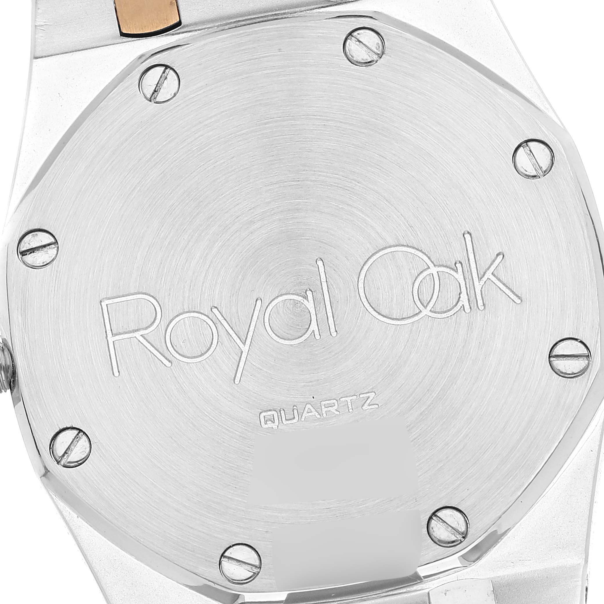 The image shows the back case of an Audemars Piguet Royal Oak 56303SA Men's Steel and Gold (two tone) Grey Dial 56303SA Men's Steel and Gold (two tone) Grey Dial watch, featuring its screws and engravings.