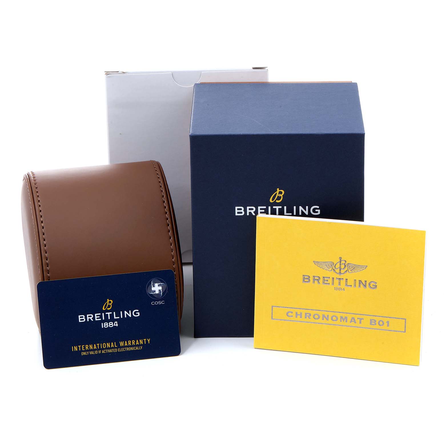 This image shows a Breitling Chronomat CB011012/C790 Men
s Steel and Gold (two tone) Black Dial CB011012/C790 Men
s Steel and Gold (two tone) Black Dial watch box, warranty card, and instruction booklet placed side by side.