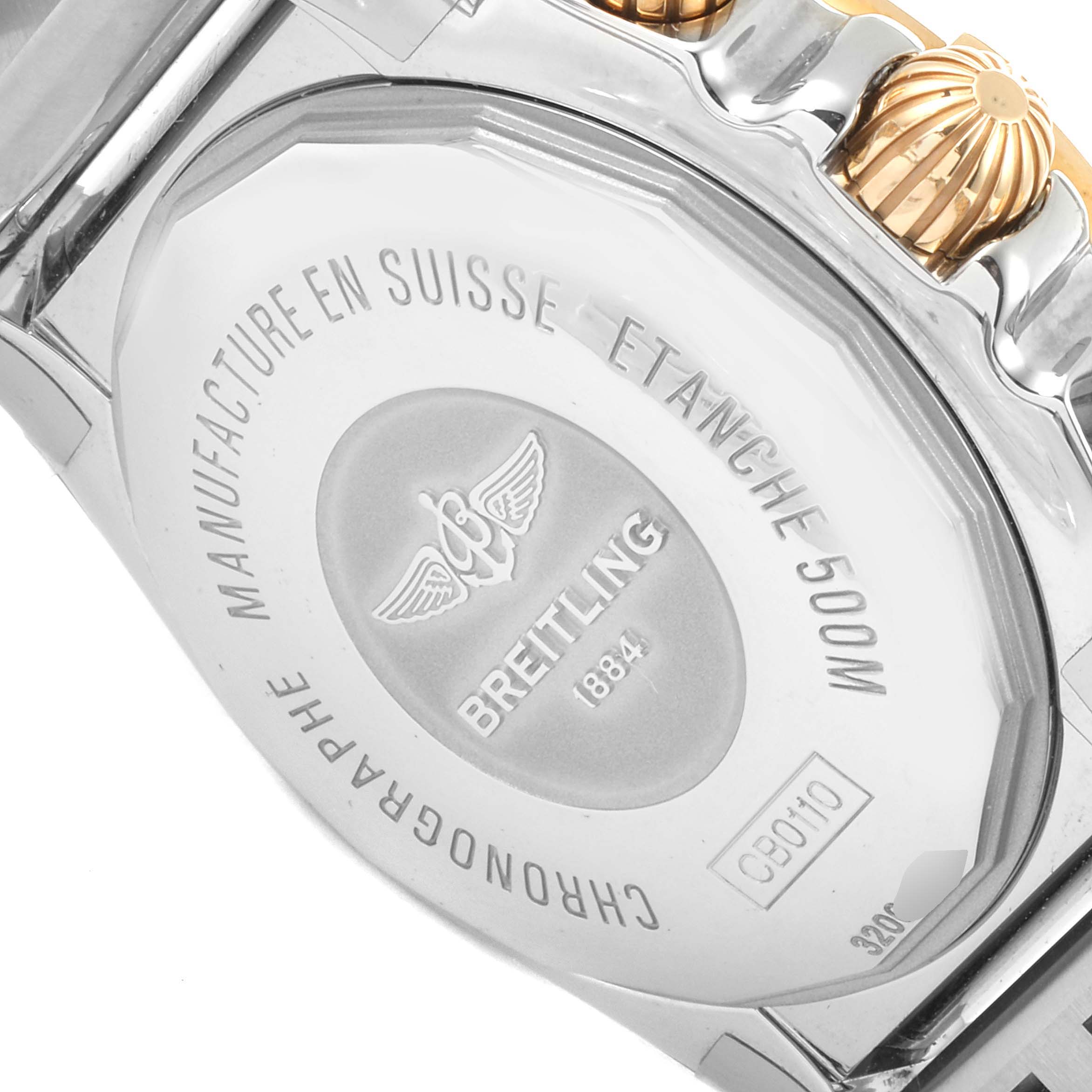 The image shows the back case of a Breitling Chronomat CB011012/C790 Men
s Steel and Gold (two tone) Black Dial CB011012/C790 Men
s Steel and Gold (two tone) Black Dial watch with engravings and adjacent crown.