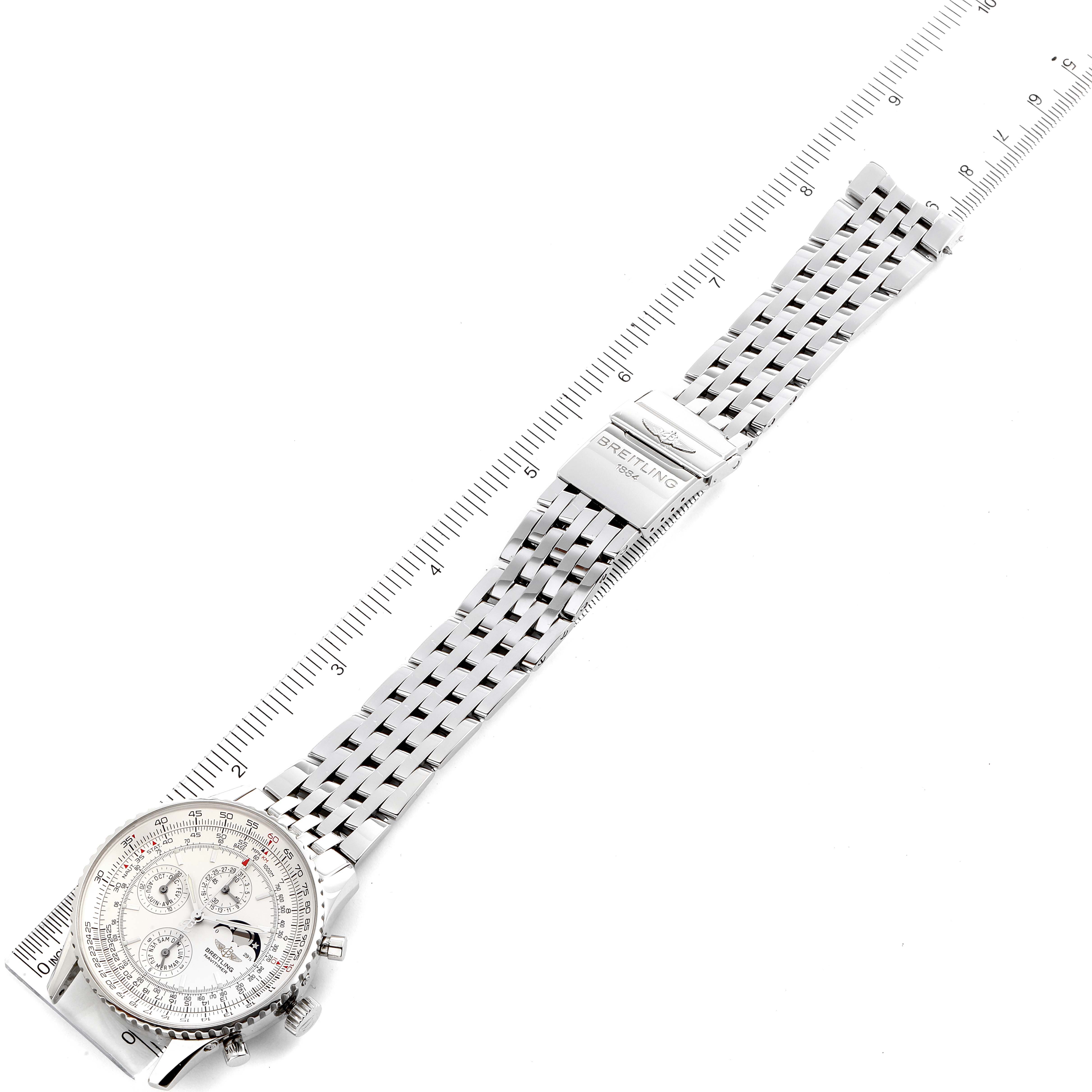 The image shows a Breitling Navitimer A19340 Men's Stainless Steel Silver Dial A19340 Men's Stainless Steel Silver Dial watch laid flat with a focus on its face, bracelet, and clasp, next to a ruler for scale.