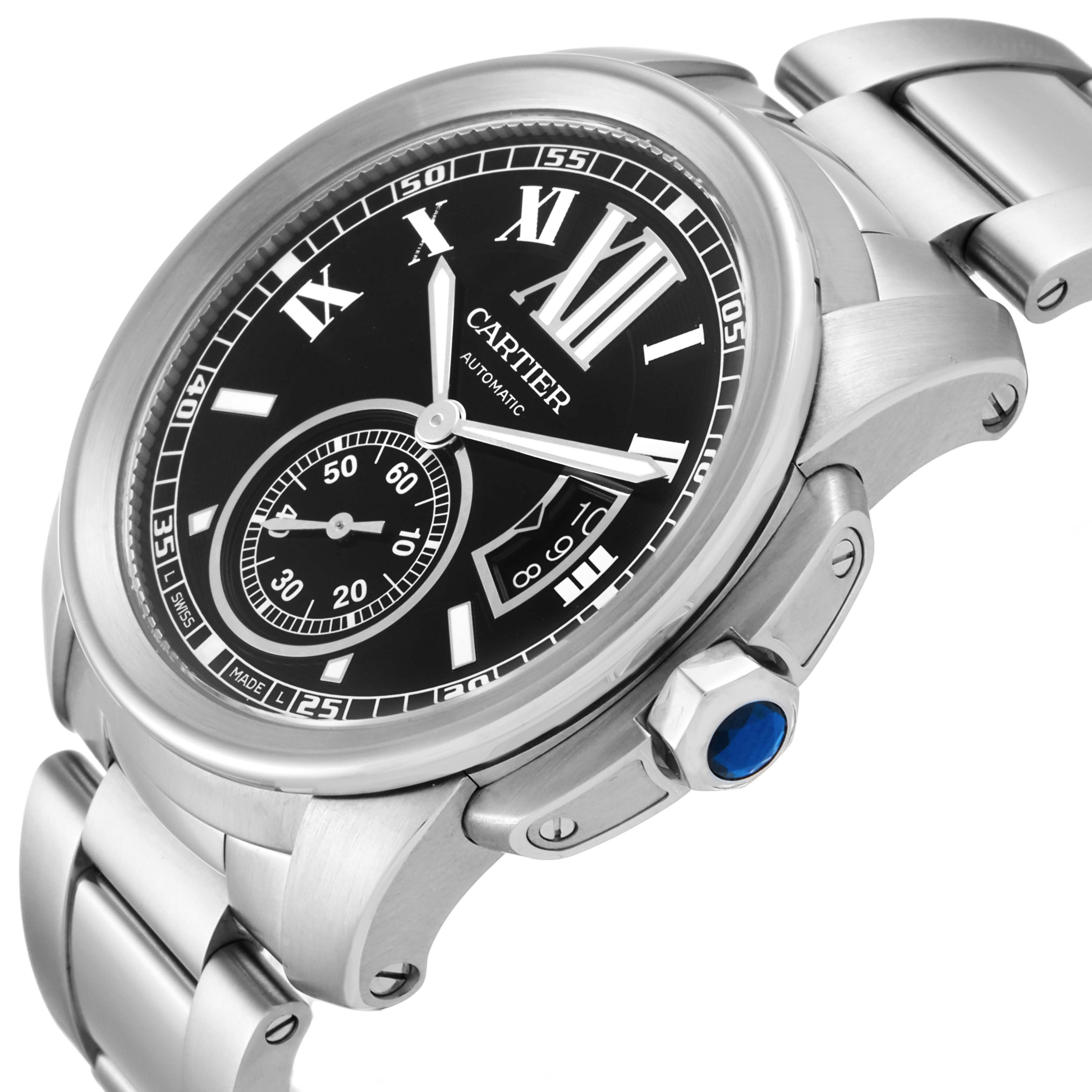 The image shows a top-angle view of the Calibre de Cartier watch by Cartier, highlighting the dial, case, bracelet, and crown.