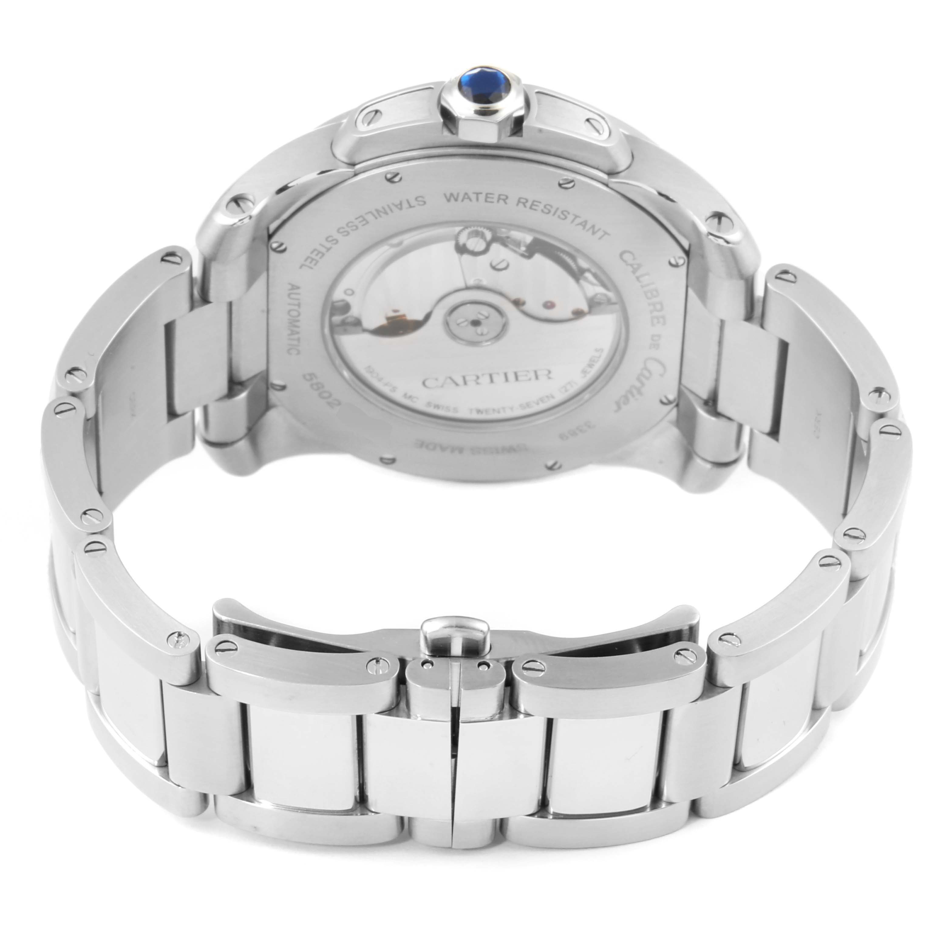 The image shows the back and bracelet of the Calibre de Cartier watch by Cartier, highlighting the automatic movement and clasp.