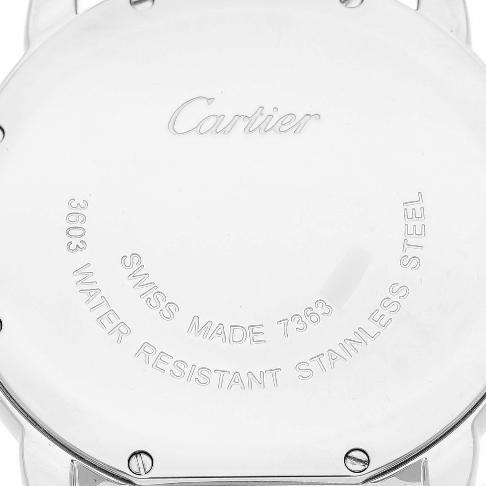 The image shows the back of a Cartier Ronde W6701005 Men's Stainless Steel Silver Dial watch, highlighting its engravings and screws.