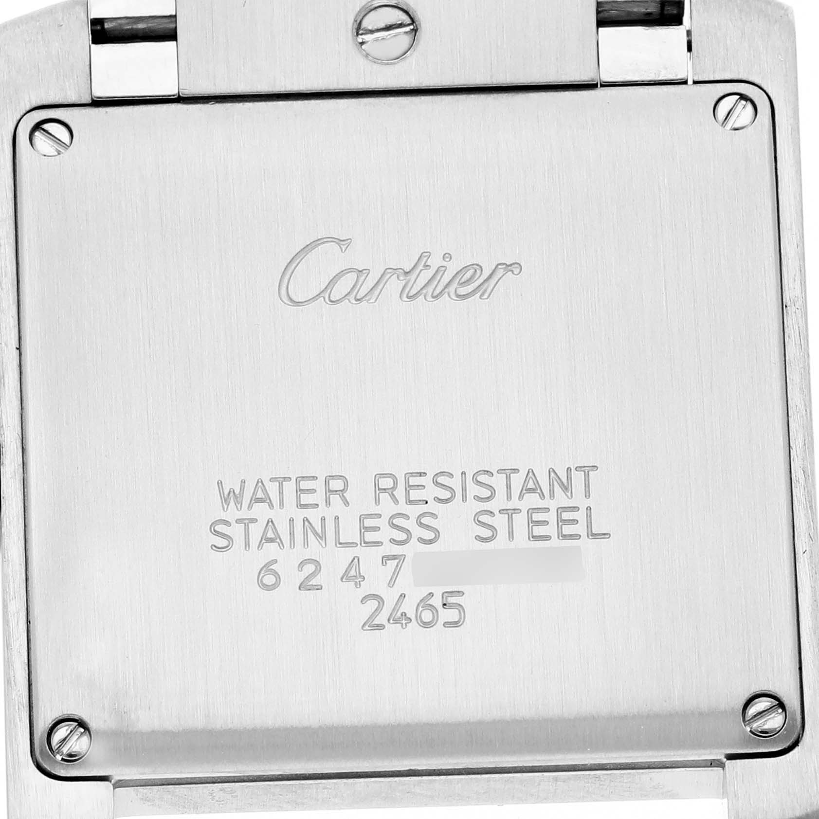 The image shows the back case of a Cartier Tank Française watch featuring engraved text and four screws.