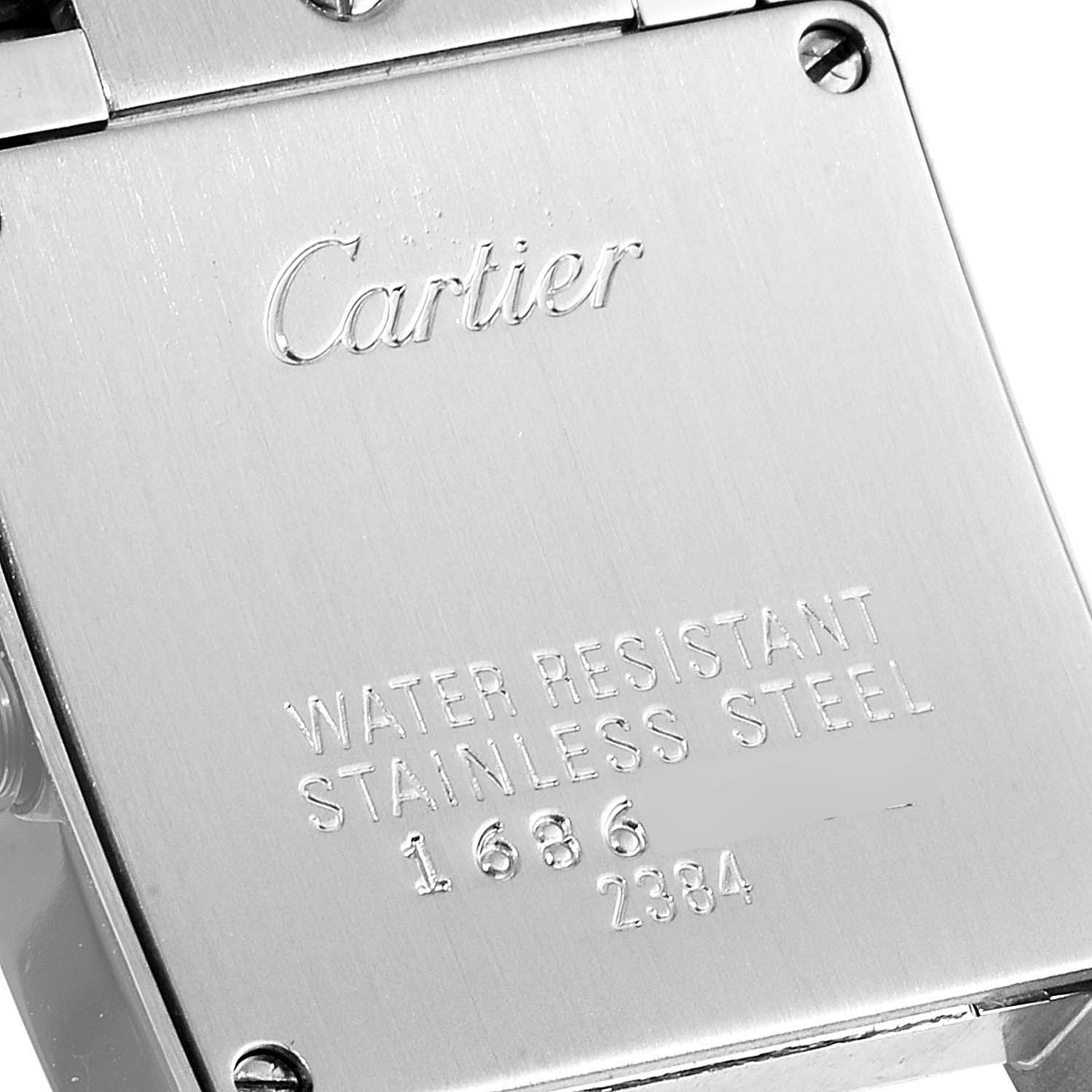 This image shows the back case of a Cartier Tank Francaise W51008Q3 Women
s Stainless Steel Silver Dial W51008Q3 Women
s Stainless Steel Silver Dial watch, highlighting its engravings.