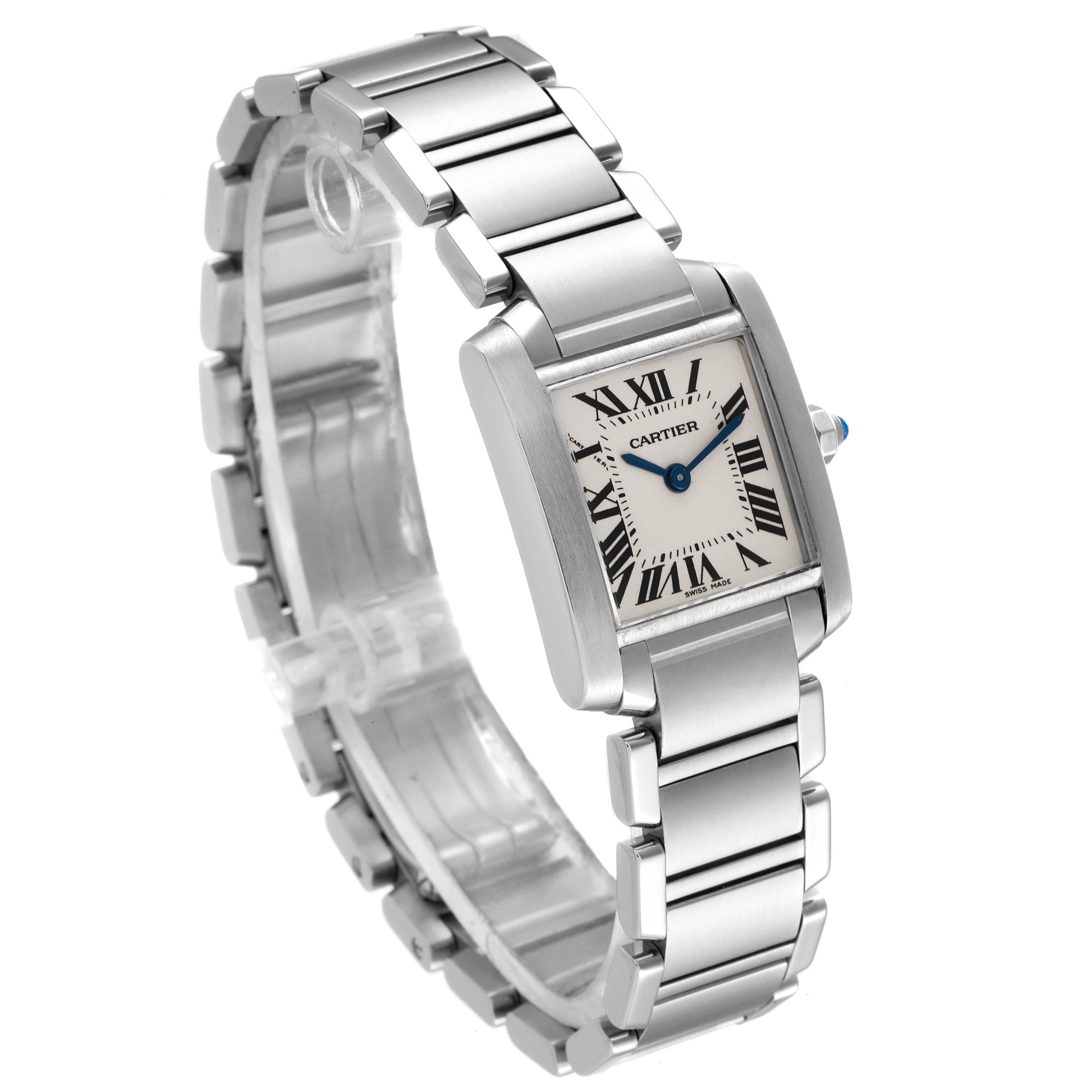 The image shows Cartier
s Tank Française watch from a three-quarter angle, highlighting its silver bracelet and rectangular face with Roman numerals.