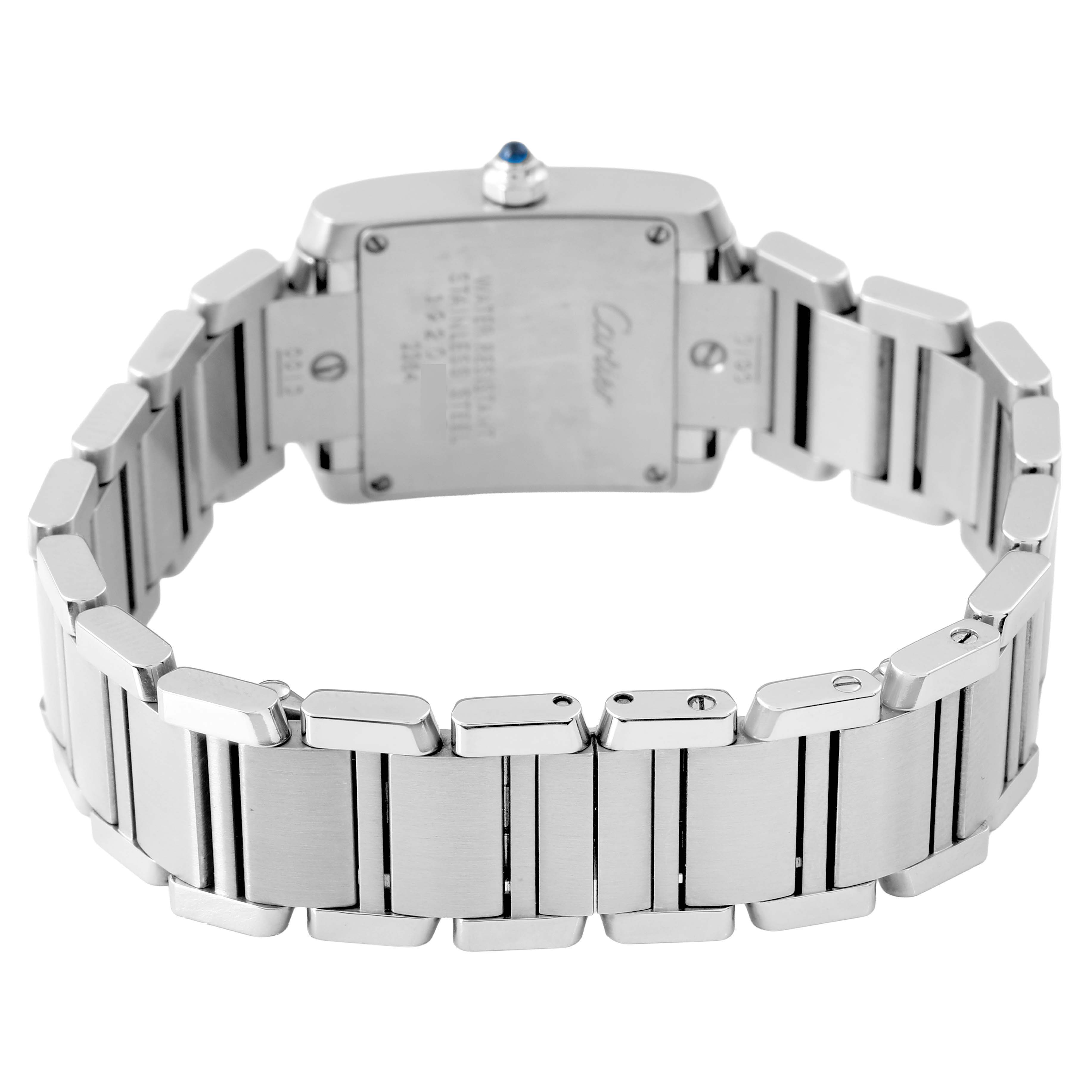 The Cartier Tank Française watch is shown from the back, displaying its stainless steel bracelet and case back with markings.