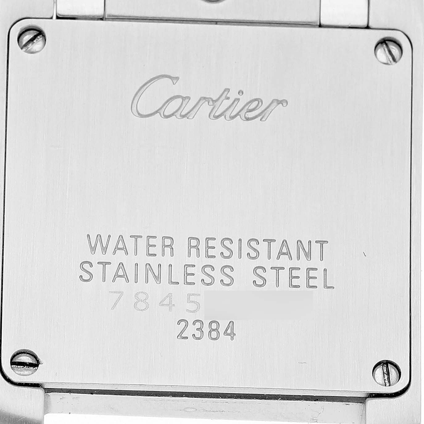 The image shows the back casing of the Cartier Tank Francaise W51028Q3 Women's Stainless Steel Pink Dial watch featuring engravings with brand details.