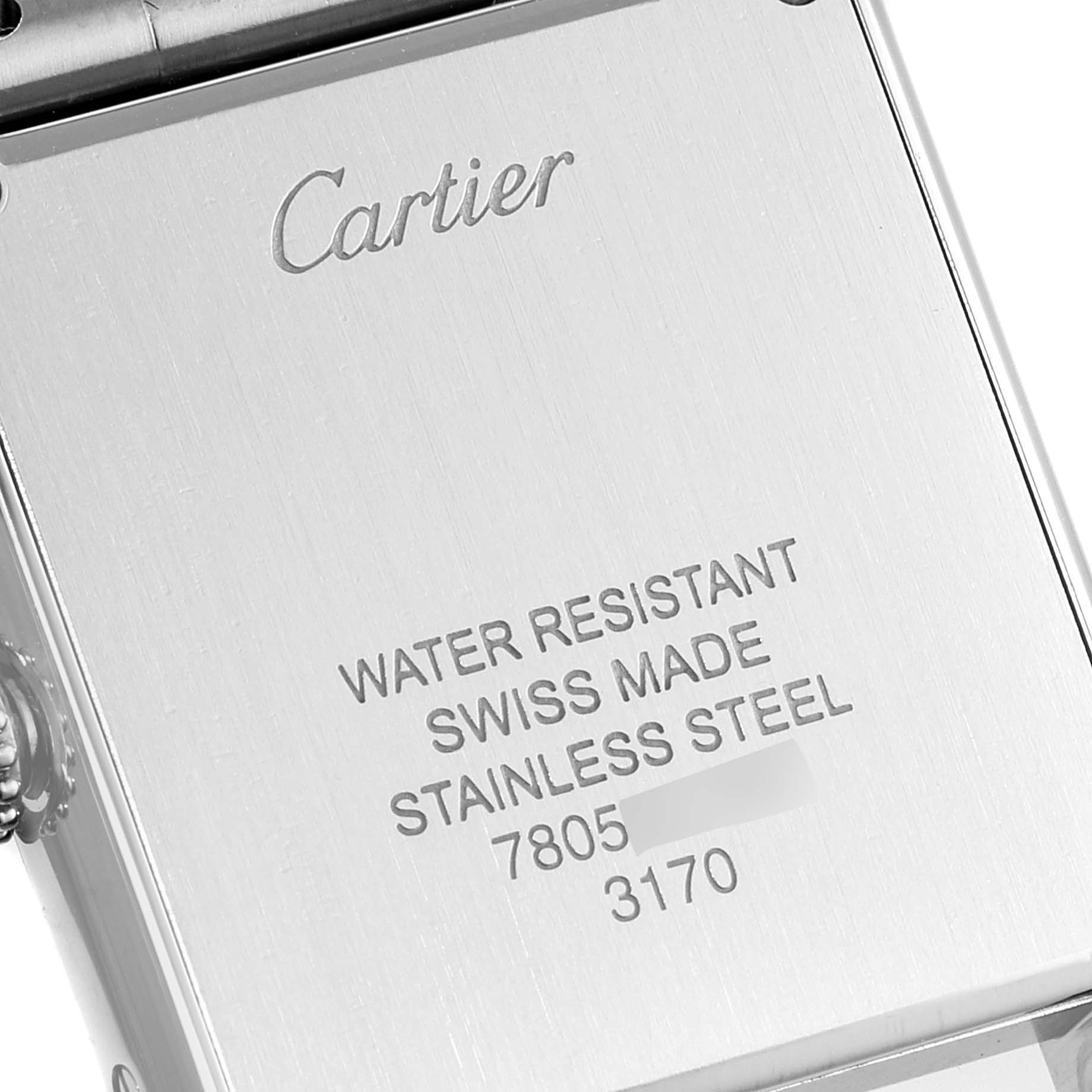 The image shows the back case of a Cartier Tank Solo W5200013 Women
s Stainless Steel Silver Dial W5200013 Women
s Stainless Steel Silver Dial watch, highlighting brand engraving and specifications.