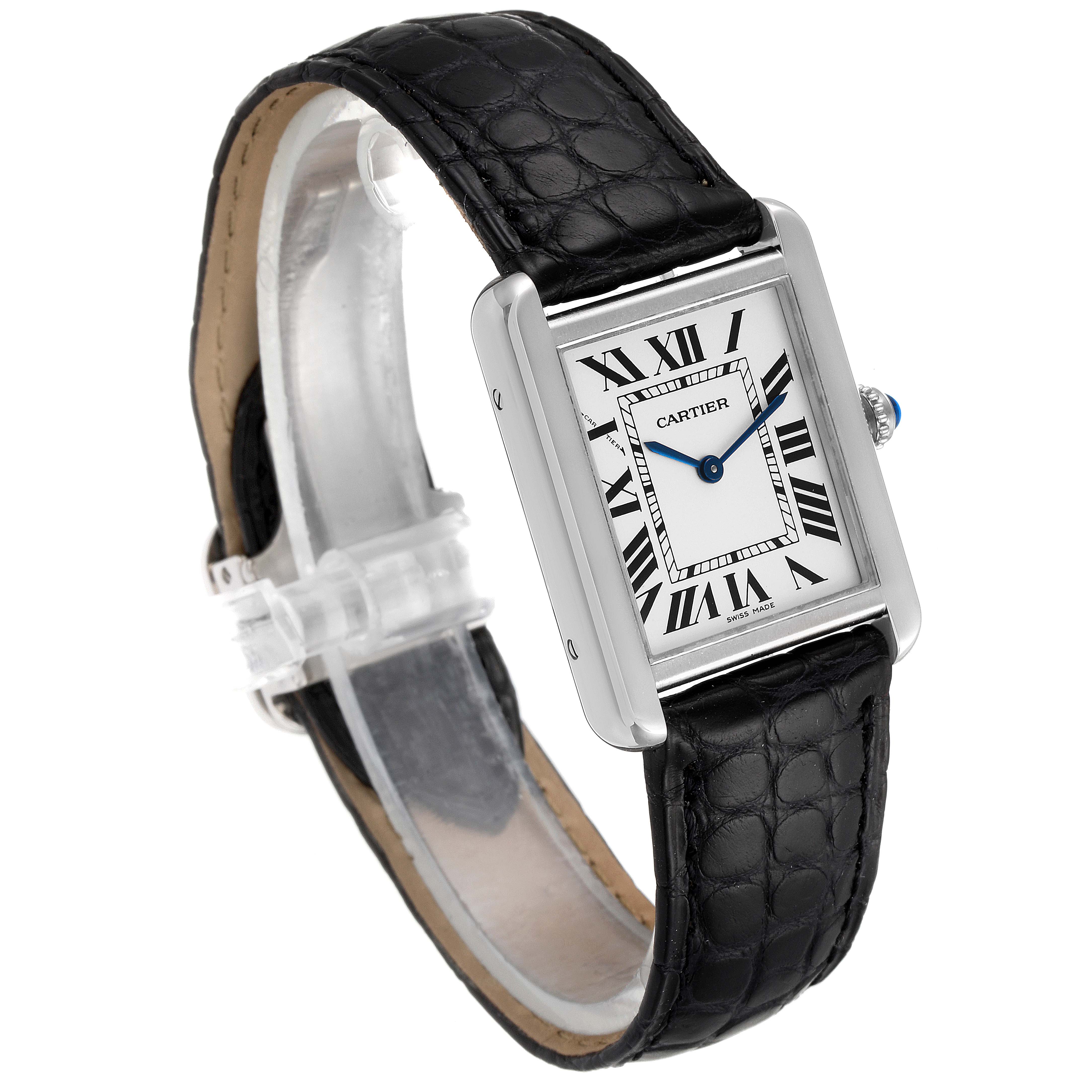 The Cartier Tank Solo W1018255 Women
s Stainless Steel Silver Dial W1018255 Women
s Stainless Steel Silver Dial watch is pictured at a three-quarter angle, showcasing its face, bezel, and black leather strap.
