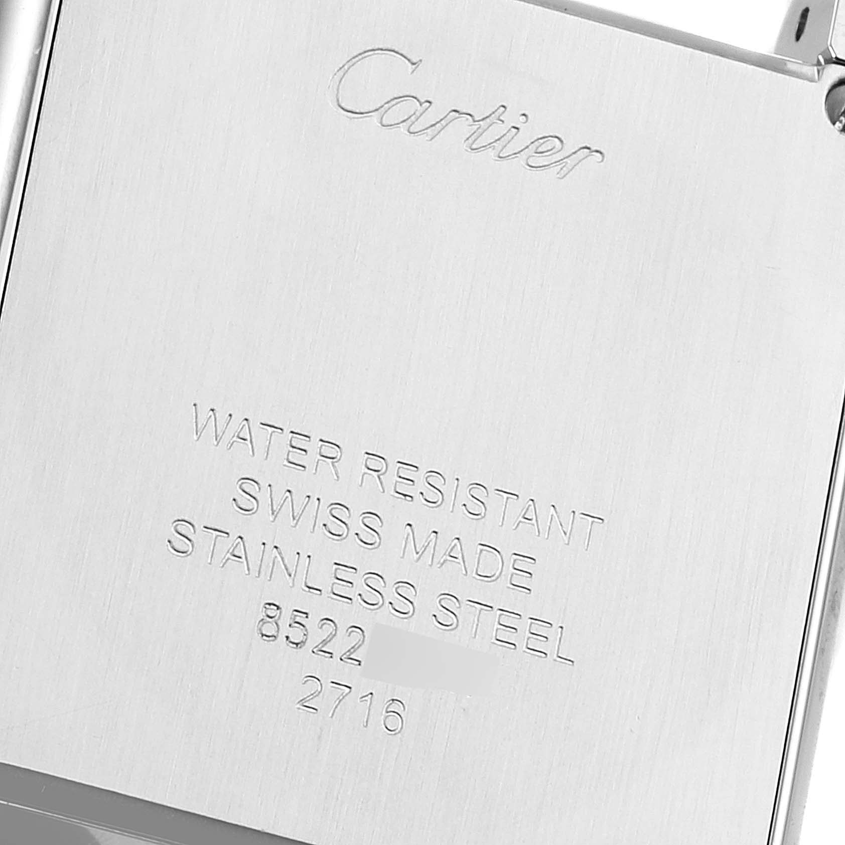 This image shows the back of the Cartier Tank Solo W1018255 Women
s Stainless Steel Silver Dial W1018255 Women
s Stainless Steel Silver Dial watch, highlighting its water resistance, Swiss origin, and stainless steel material.