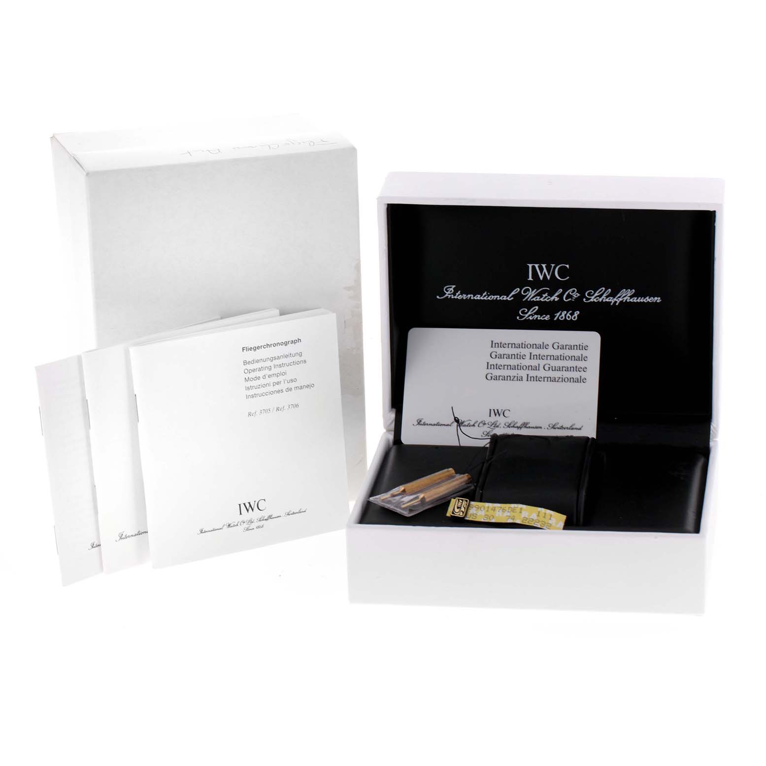 The image shows the packaging box, booklets, warranty card, and accessories for the IWC Pilot IW370607 Men's Stainless Steel Black Dial IW370607 Men's Stainless Steel Black Dial model watch.