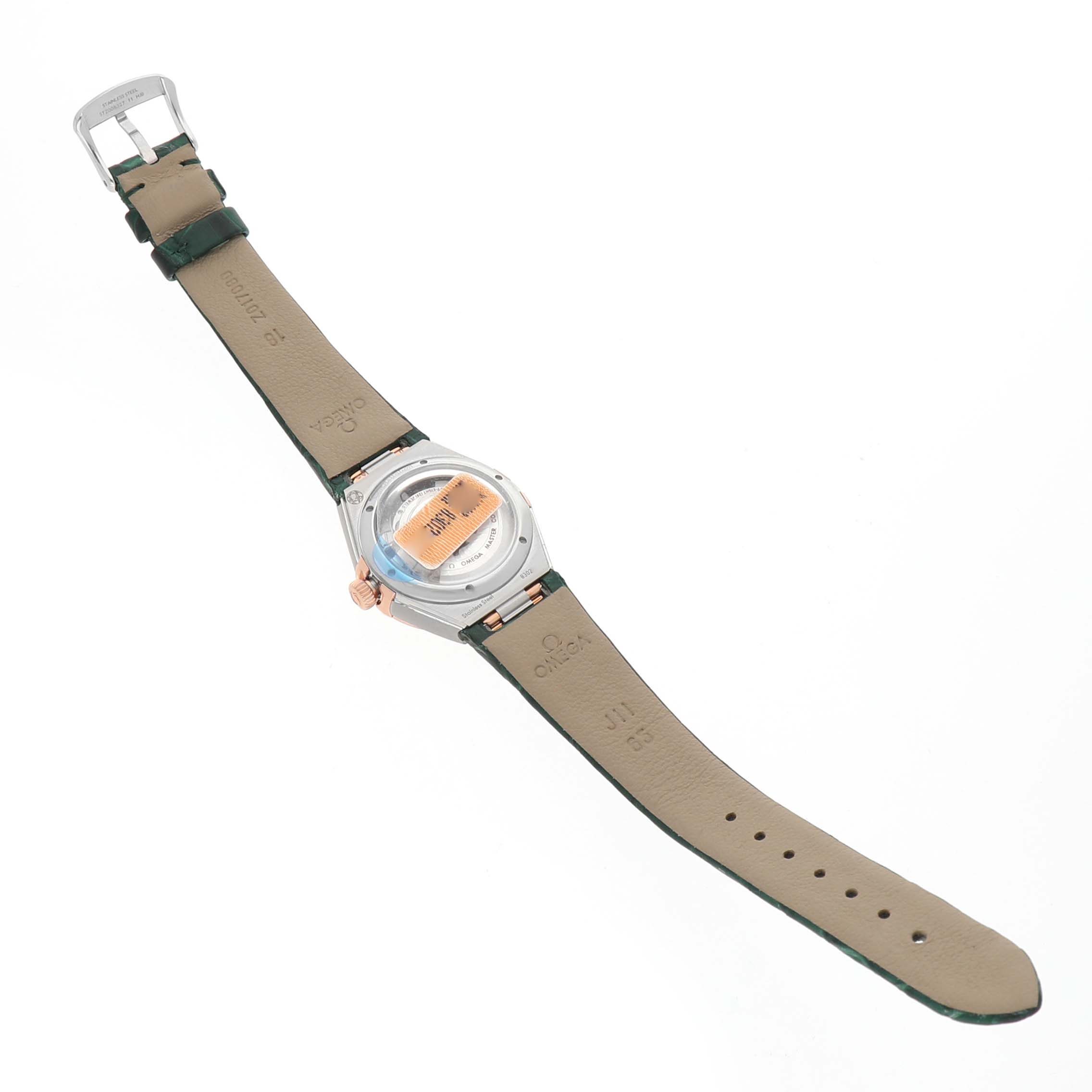 The Omega 131.23.29.20.99.001 Women's Steel and Gold (two tone) Green Dial Constellation 29 Diamond Steel Rose Gold watch is shown from the back, displaying the leather strap and case back.