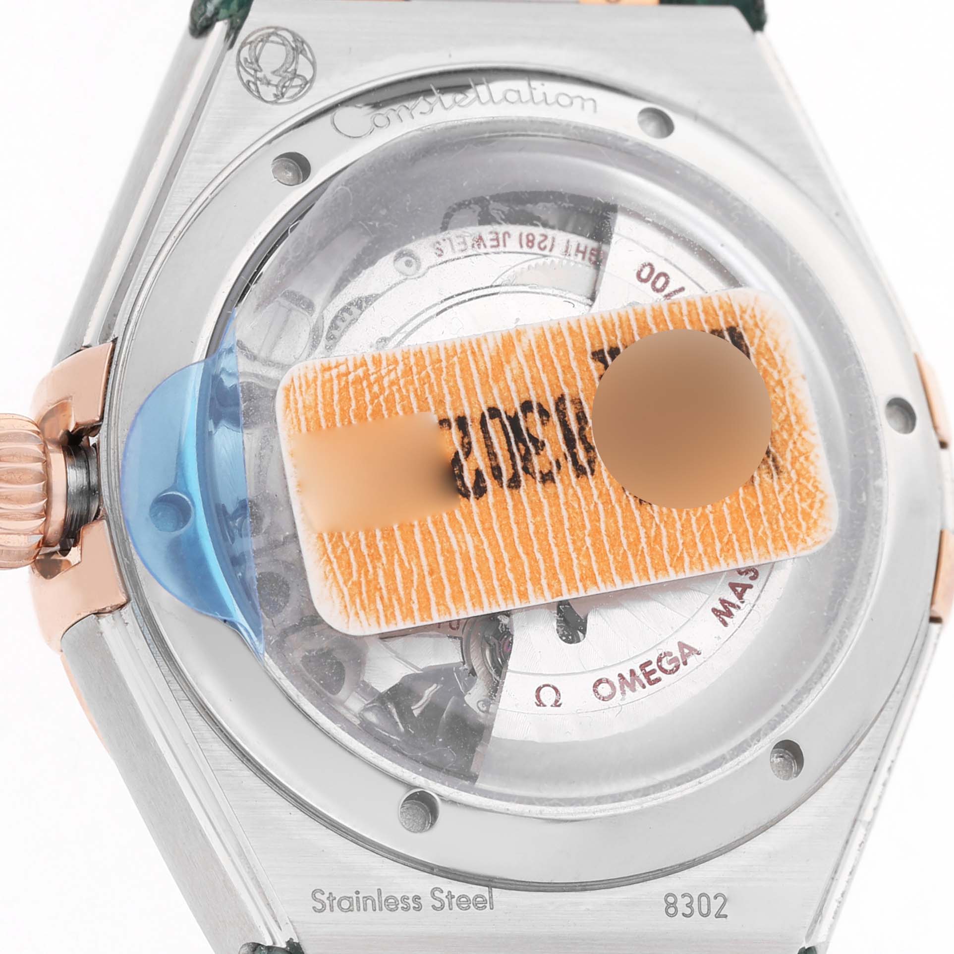 The image shows the back of the Omega 131.23.29.20.99.001 Women's Steel and Gold (two tone) Green Dial Constellation 29 Diamond Steel Rose Gold, highlighting the case back and crown area.