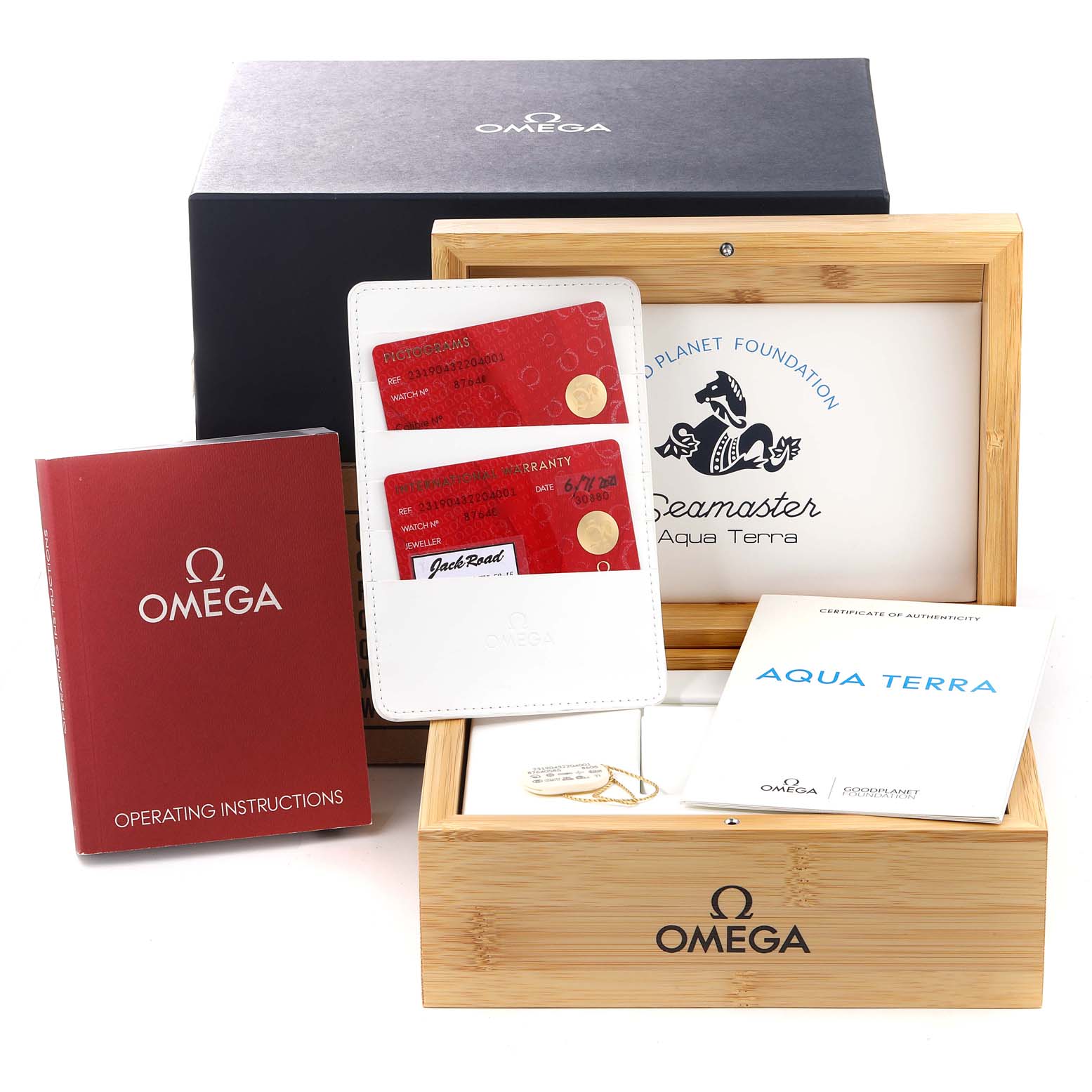 The image shows accessories for Omega Aqua Terra 231.90.43.22.04.001 Men's Titanium White Dial 231.90.43.22.04.001 Men's Titanium White Dial, including a box, manuals, cardholder, warranty cards, and presentation case.