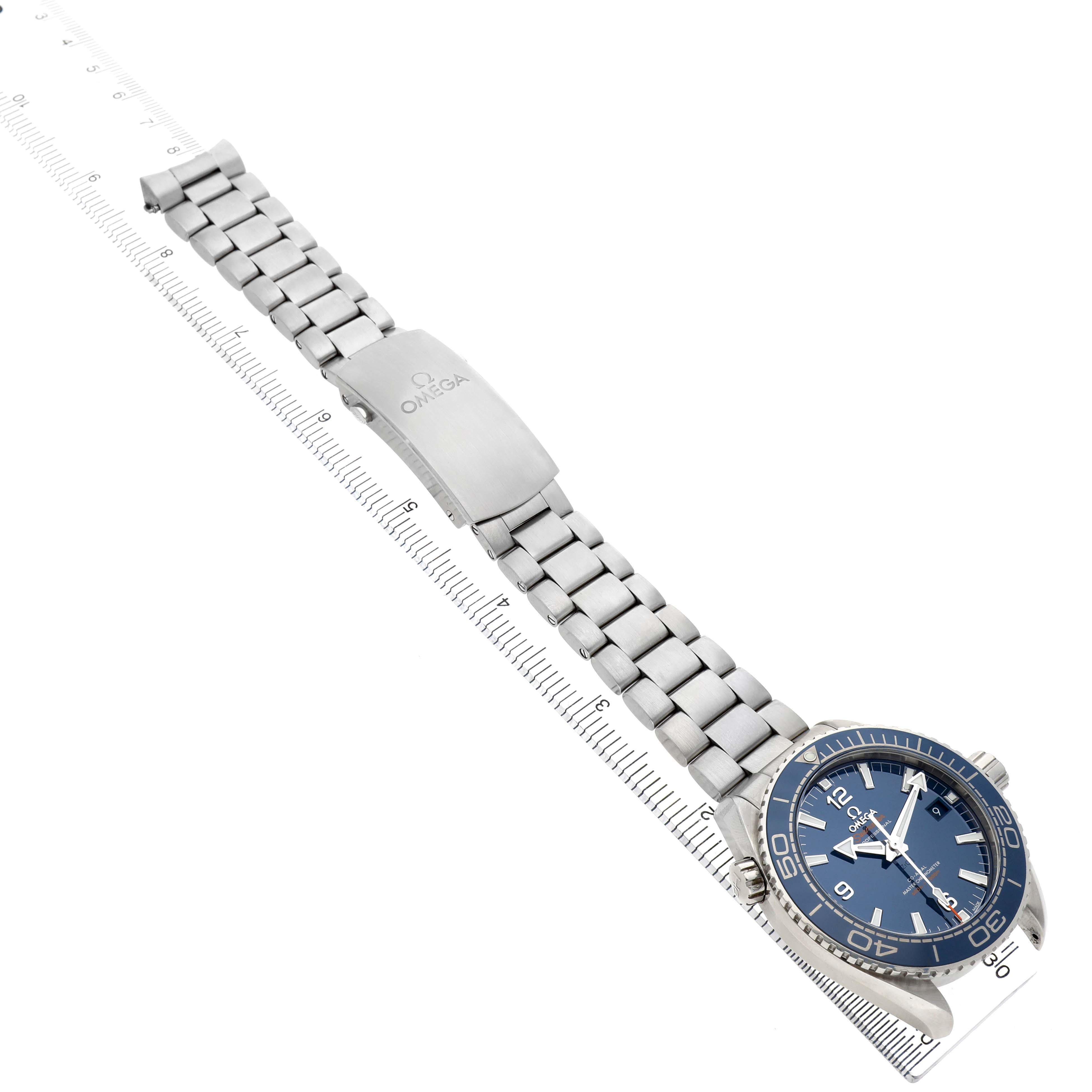 The Omega Planet Ocean 215.30.44.21.03.001 Men's Stainless Steel Blue Dial watch is shown at an angled top view, highlighting the face, bezel, bracelet, and clasp.