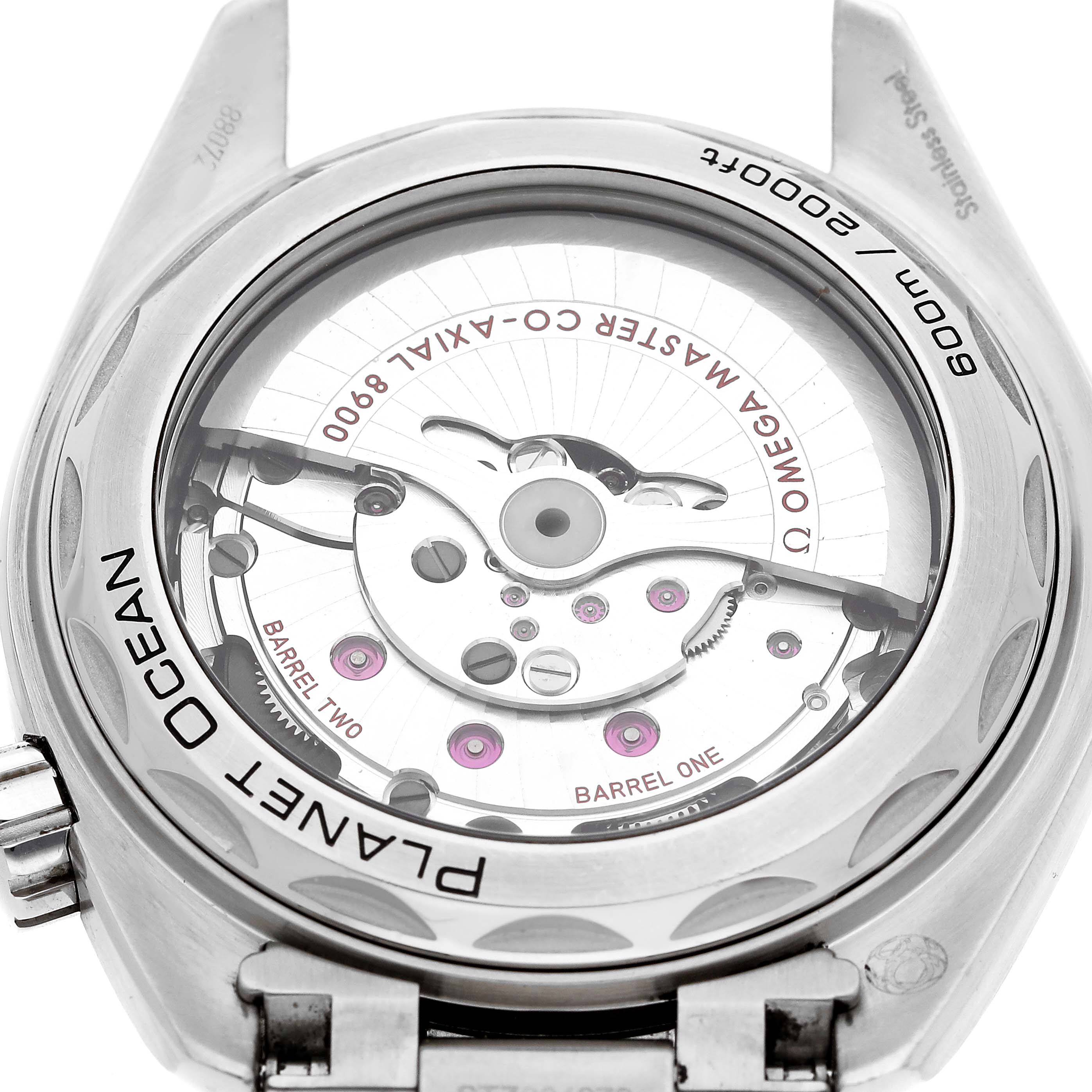 The image shows the back view of the Omega Planet Ocean 215.30.44.21.03.001 Men's Stainless Steel Blue Dial watch, highlighting its movement and internal mechanisms.