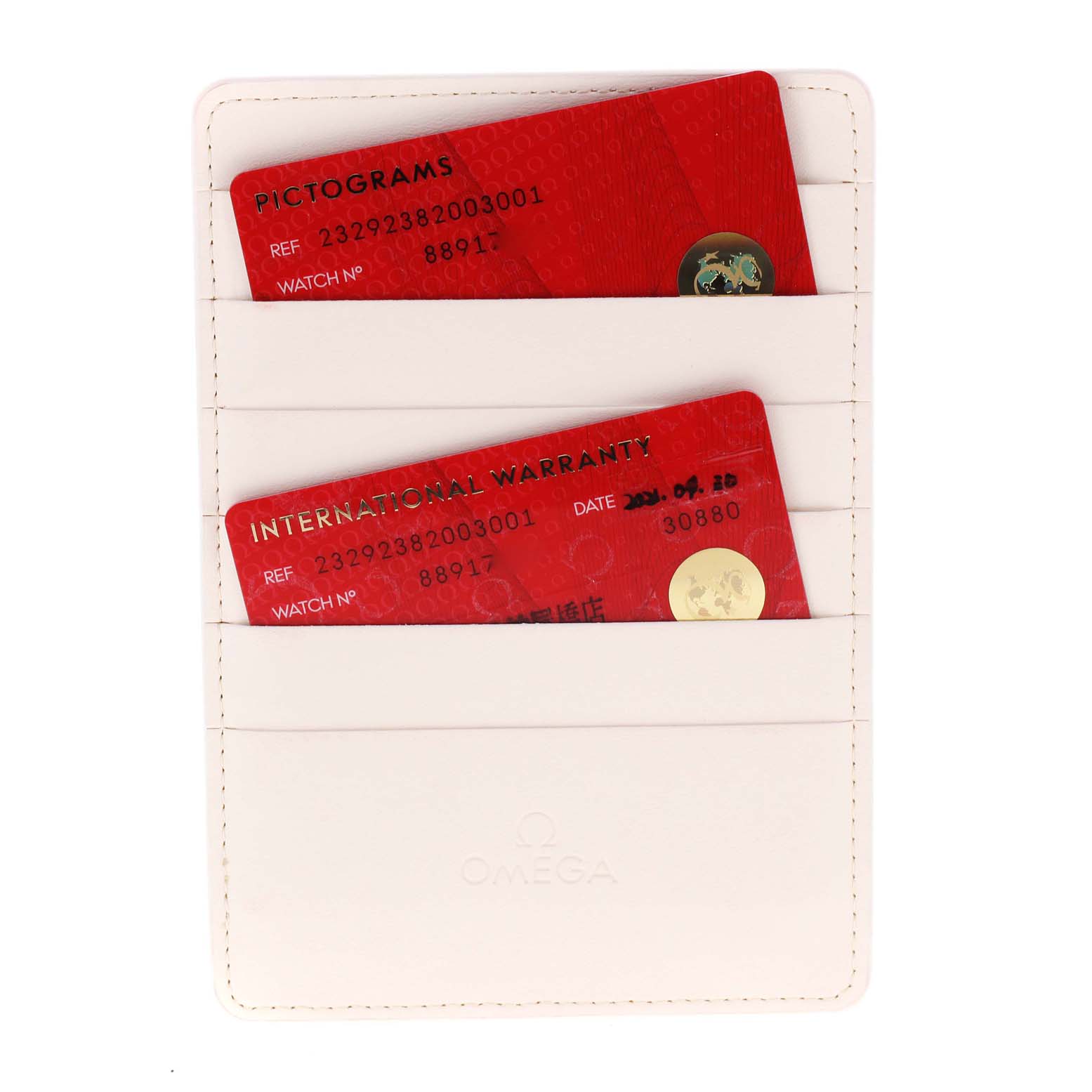 This image shows the pictograms and international warranty cards for an Omega Planet Ocean 232.92.38.20.03.001 Men's Titanium Blue Dial 232.92.38.20.03.001 Men's Titanium Blue Dial watch in a white cardholder.