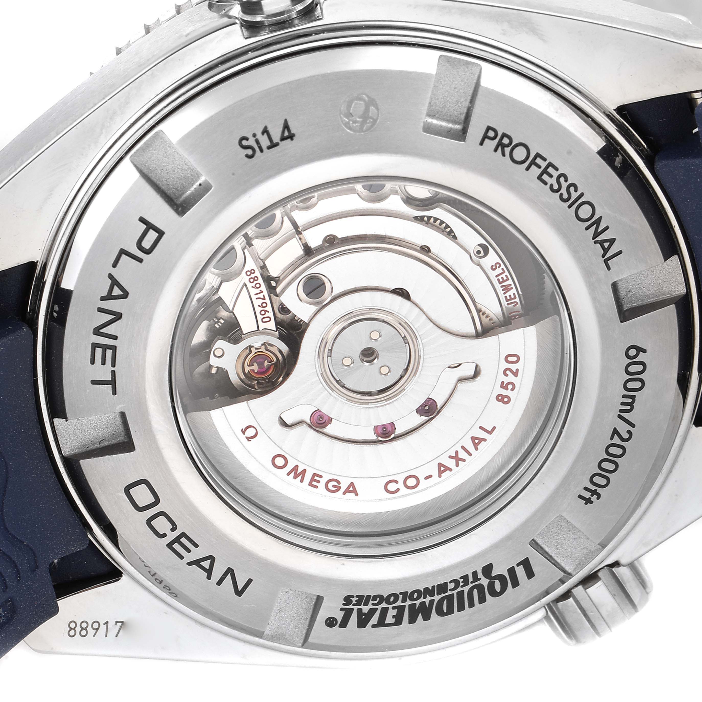 This image shows the case back of the Omega Planet Ocean 232.92.38.20.03.001 Men's Titanium Blue Dial 232.92.38.20.03.001 Men's Titanium Blue Dial watch, revealing the inner mechanical movement and inscriptions.
