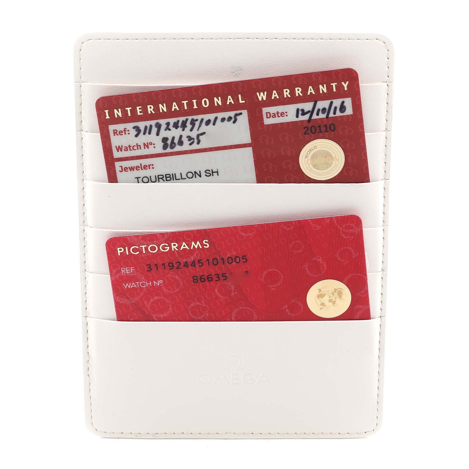 This image shows the warranty and pictogram cards for an Omega Speedmaster 311.92.44.51.01.005 Men's Ceramic Black Dial 311.92.44.51.01.005 Men's Ceramic Black Dial watch in a white cardholder.