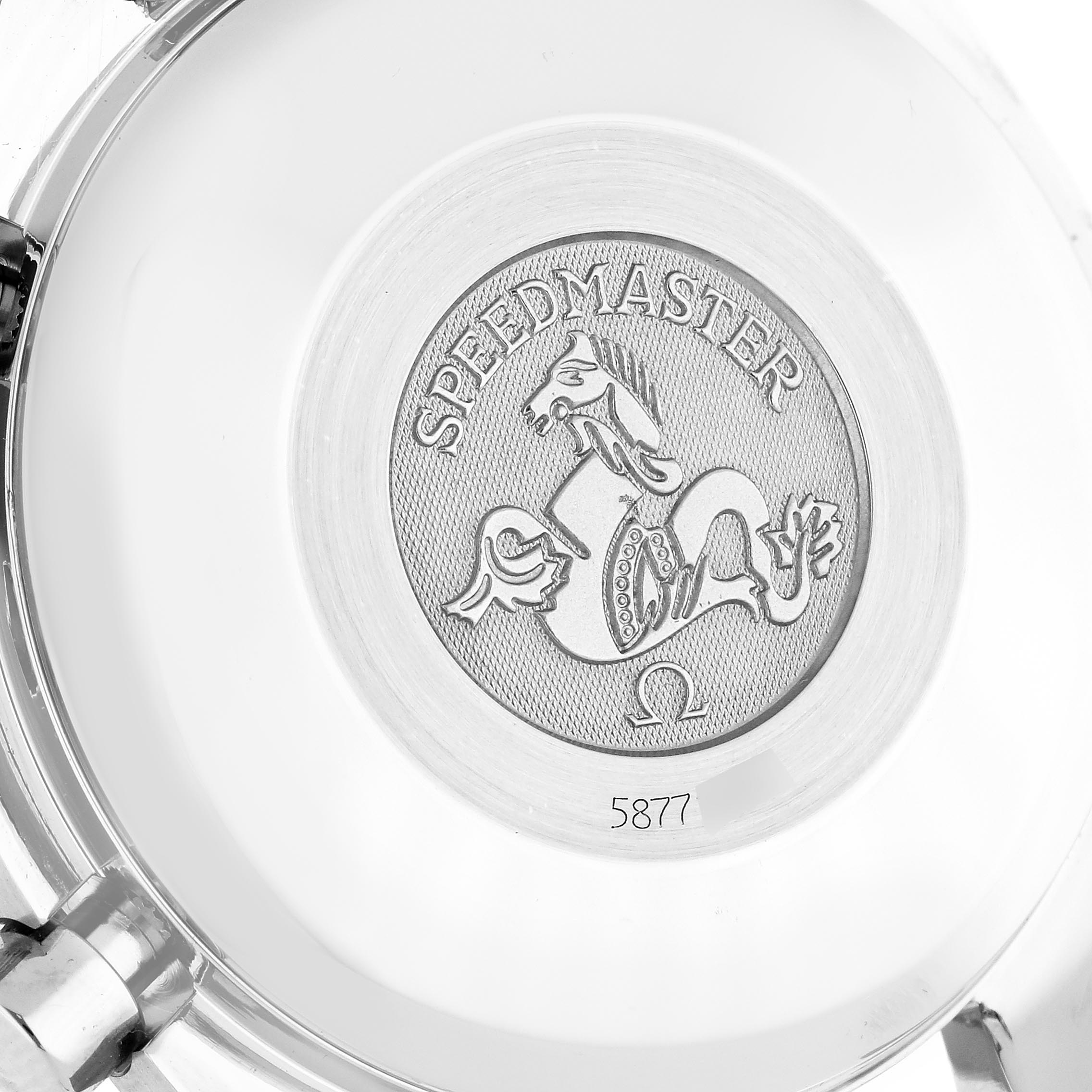 The image shows the case back of an Omega Speedmaster 3513.50.00 Men's Stainless Steel Black Dial 3513.50.00 Men's Stainless Steel Black Dial watch, featuring the emblem and serial number.