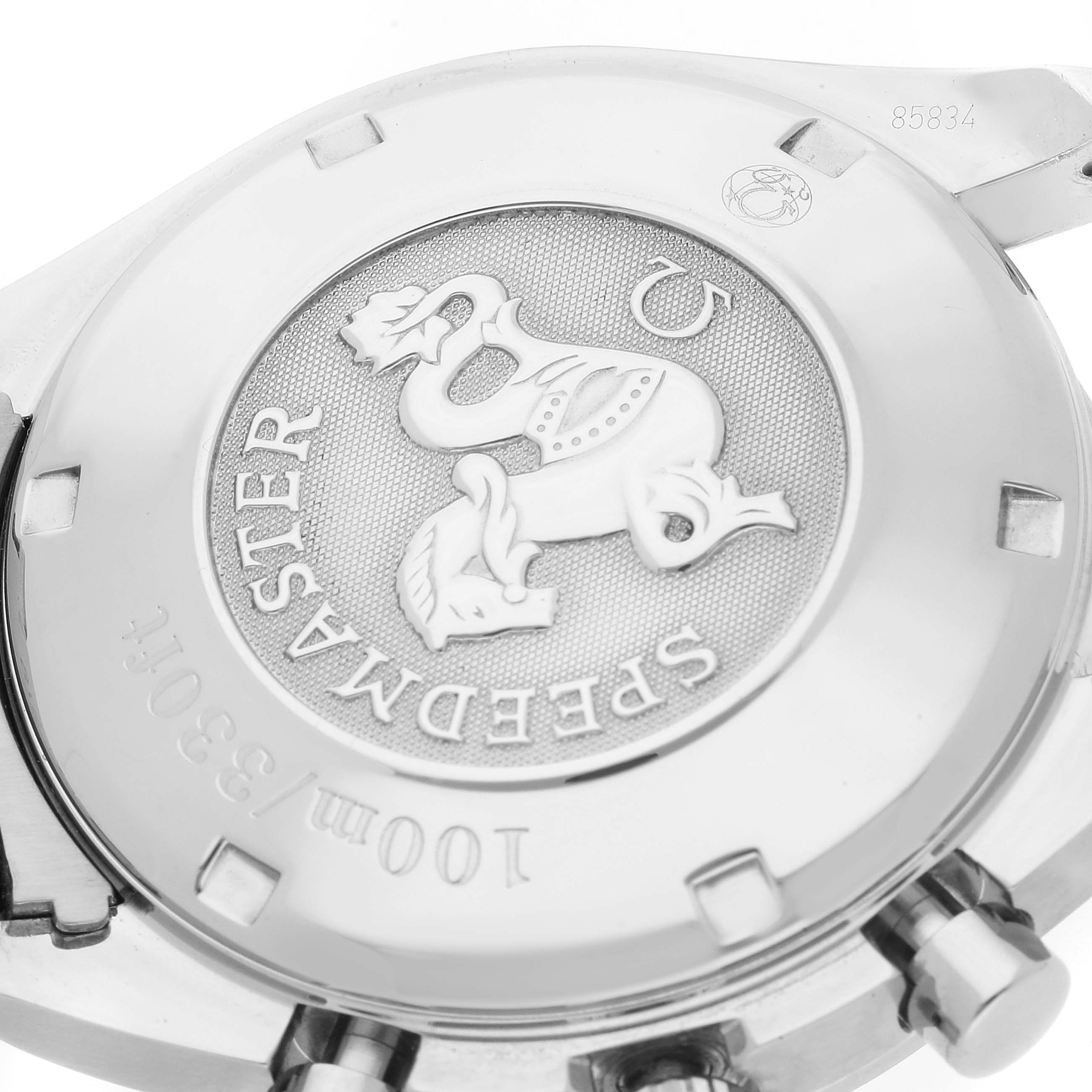 The image shows the back case of an Omega Speedmaster 3211.30.00 Men's Stainless Steel Silver Dial 3211.30.00 Men's Stainless Steel Silver Dial watch, highlighting the engraved emblem and model details.