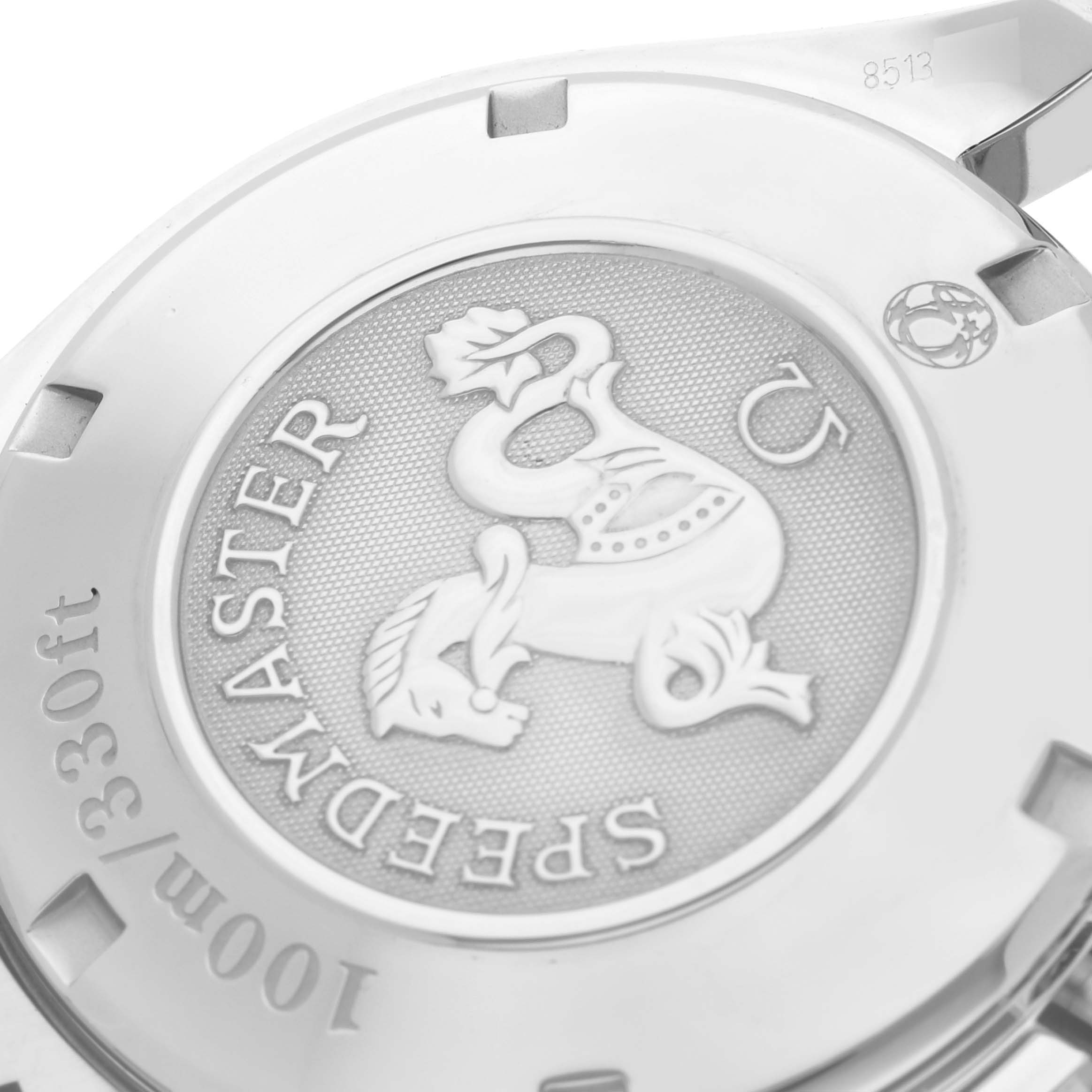 The image shows the case back of an Omega Speedmaster 323.30.40.40.06.001 Men's Stainless Steel Grey Dial 323.30.40.40.06.001 Men's Stainless Steel Grey Dial, featuring an embossed emblem and text detailing water resistance.