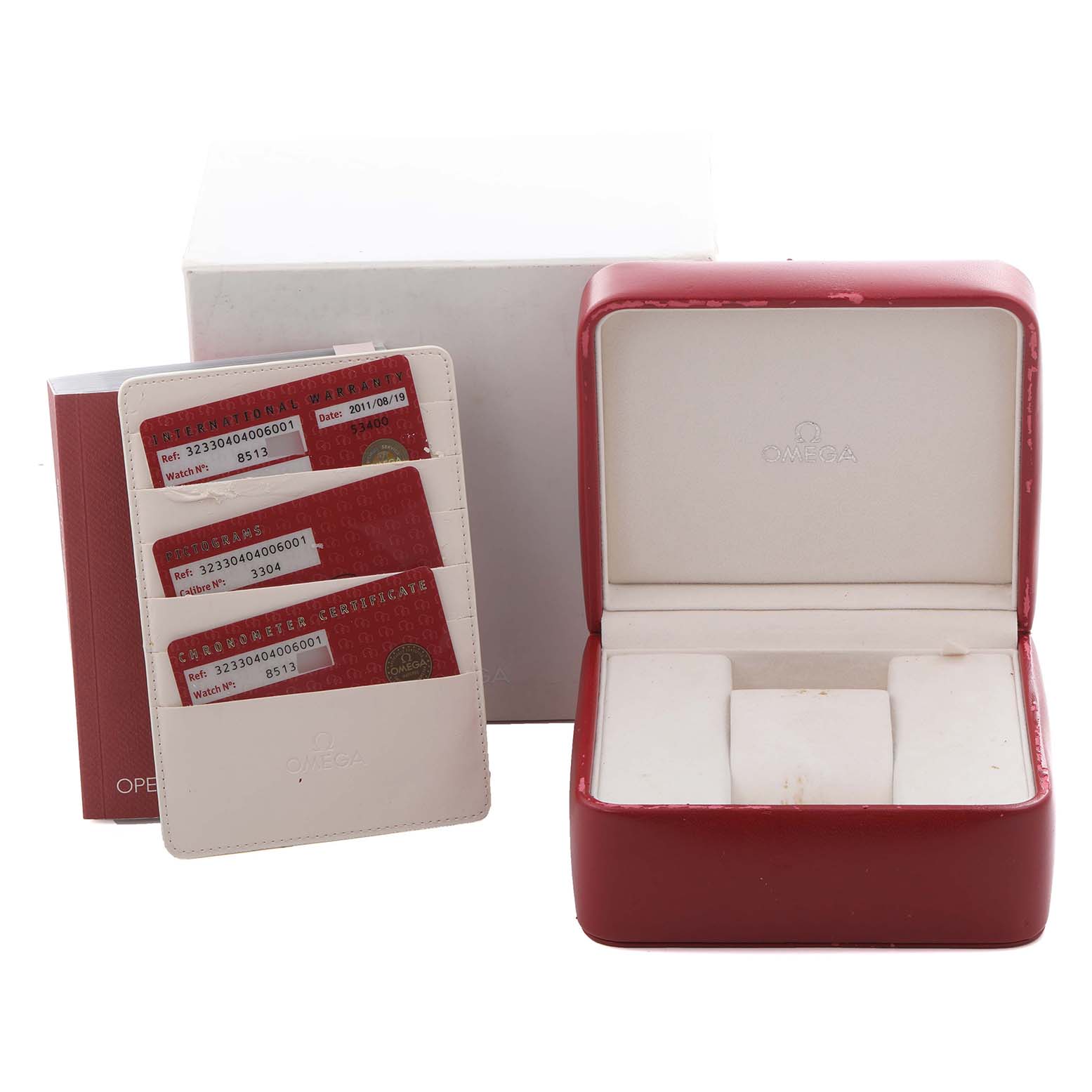 The image shows an Omega Speedmaster 323.30.40.40.06.001 Men's Stainless Steel Grey Dial 323.30.40.40.06.001 Men's Stainless Steel Grey Dial watch box and identification cards, viewed from the front.