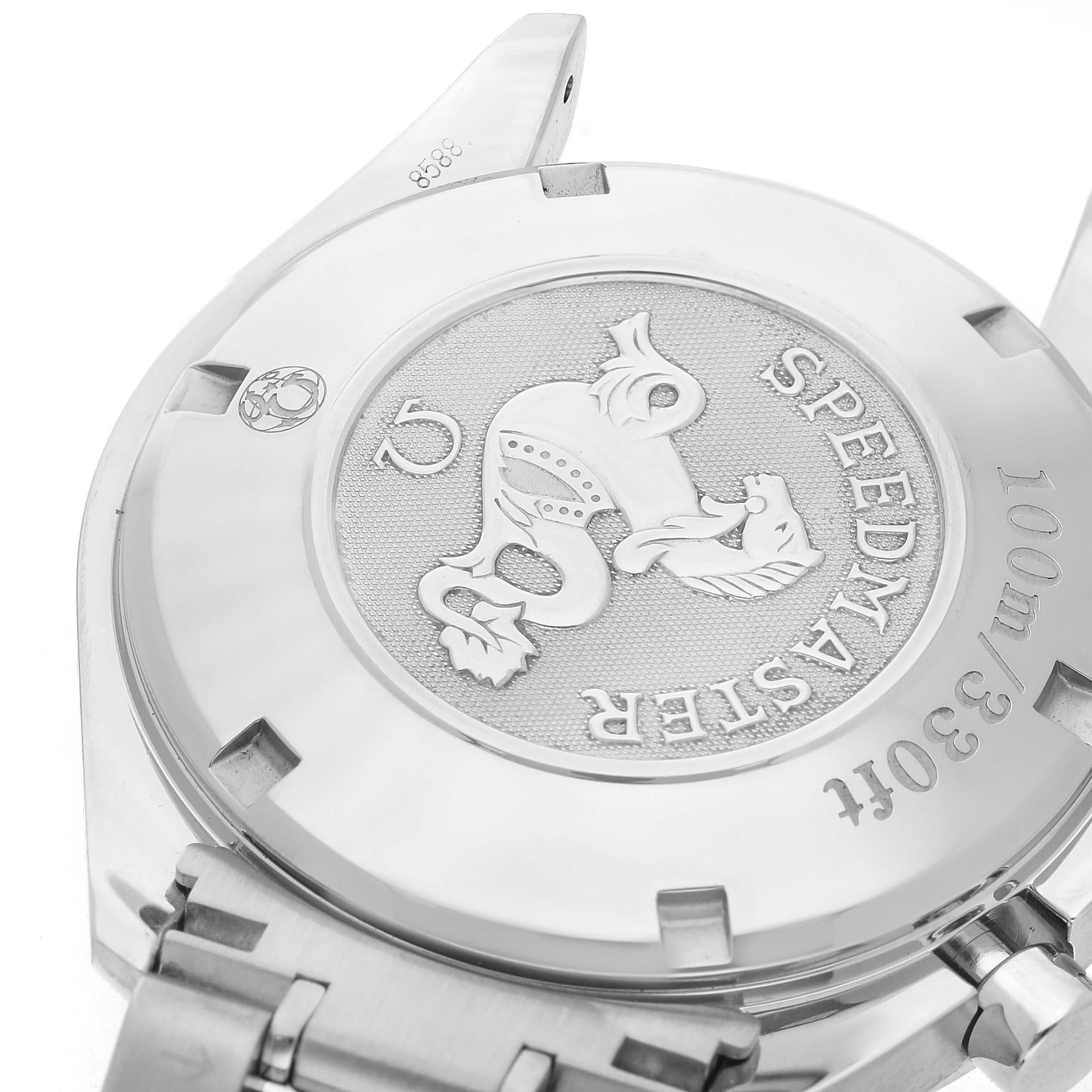 The image shows the back case of the Omega Speedmaster 323.30.40.40.06.001 Men's Stainless Steel Grey Dial, featuring engraved details and part of the bracelet.