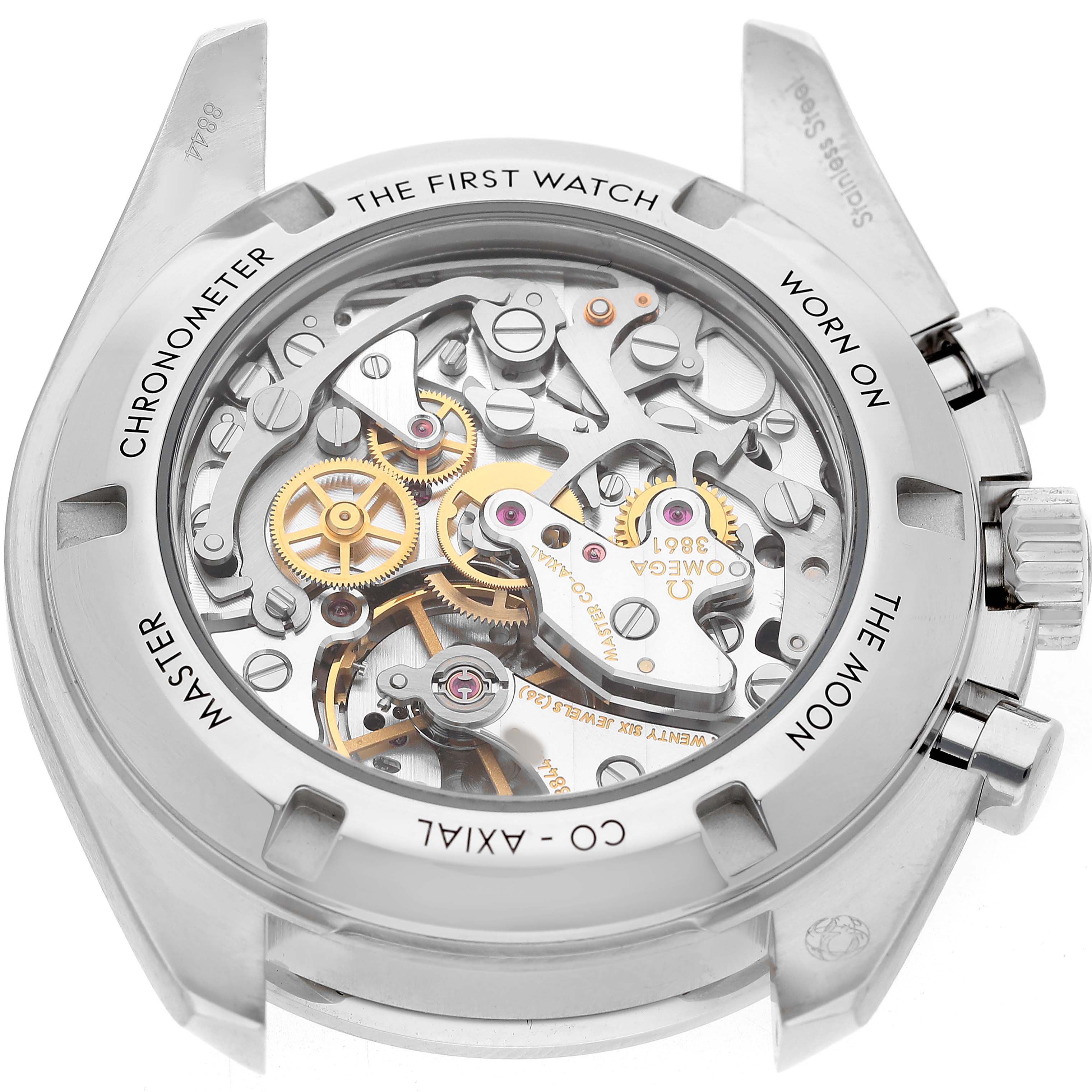 The image shows the back of the Omega Speedmaster 310.32.42.50.04.002 Men's Stainless Steel White Dial, highlighting its exposed movement and engravings.