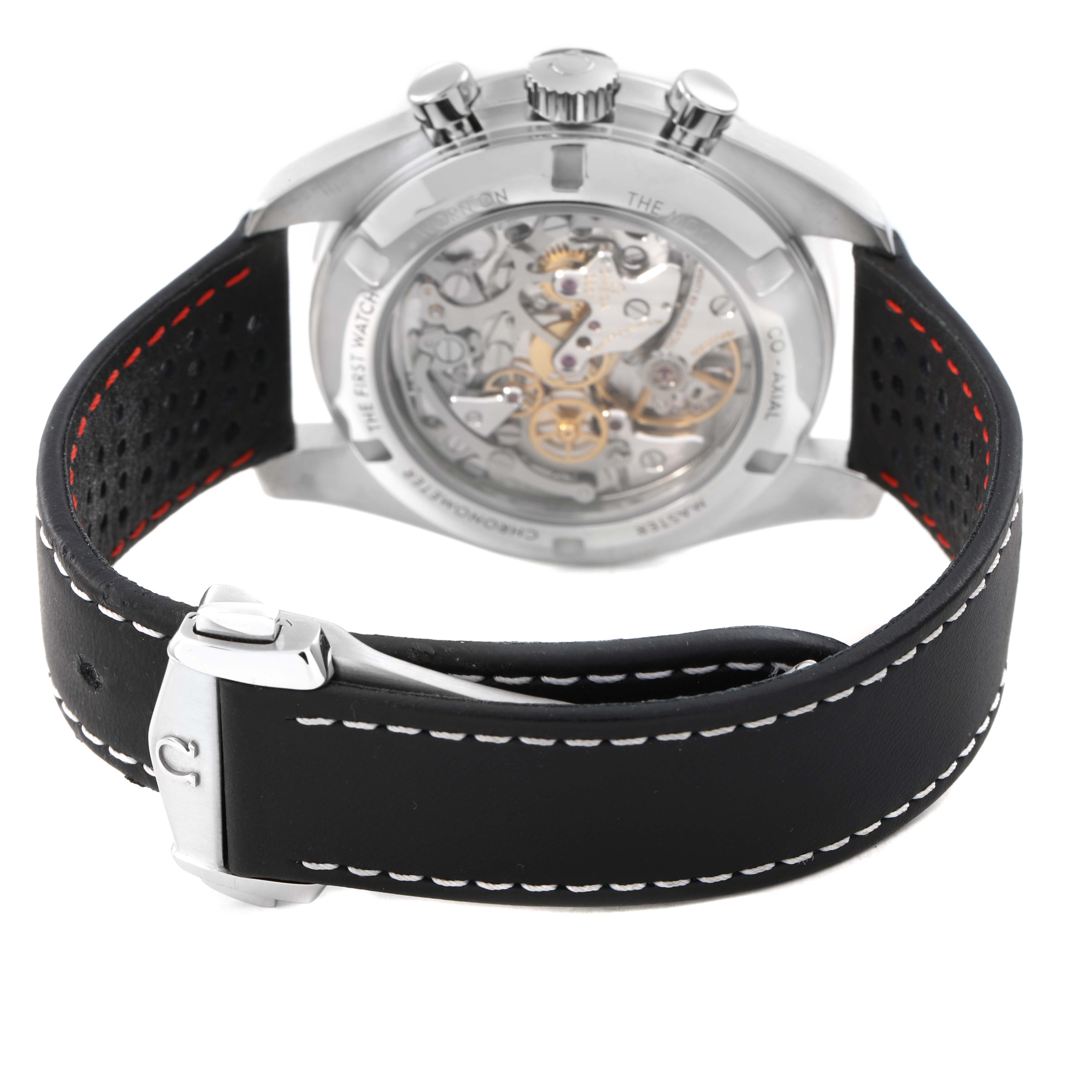 The image shows the Omega Speedmaster 310.32.42.50.04.002 Men's Stainless Steel White Dial model from the back, highlighting the transparent case back and black strap with clasp.