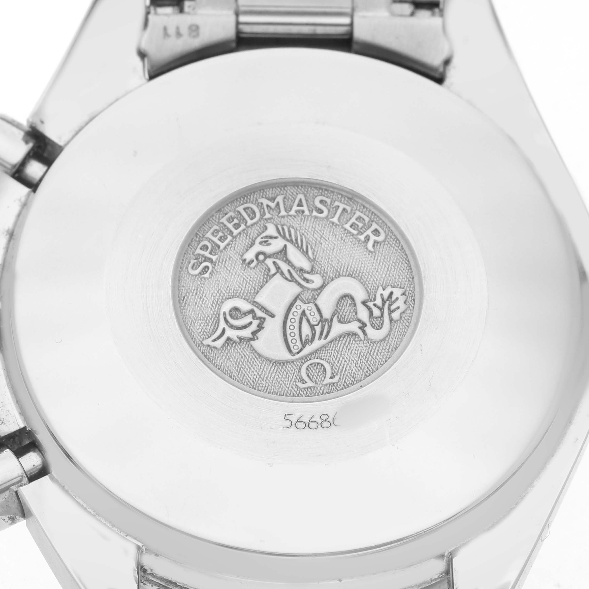 The image shows the case back of the Omega Speedmaster 3510.50.00 Men's Stainless Steel Black Dial watch featuring its emblem and engraving.