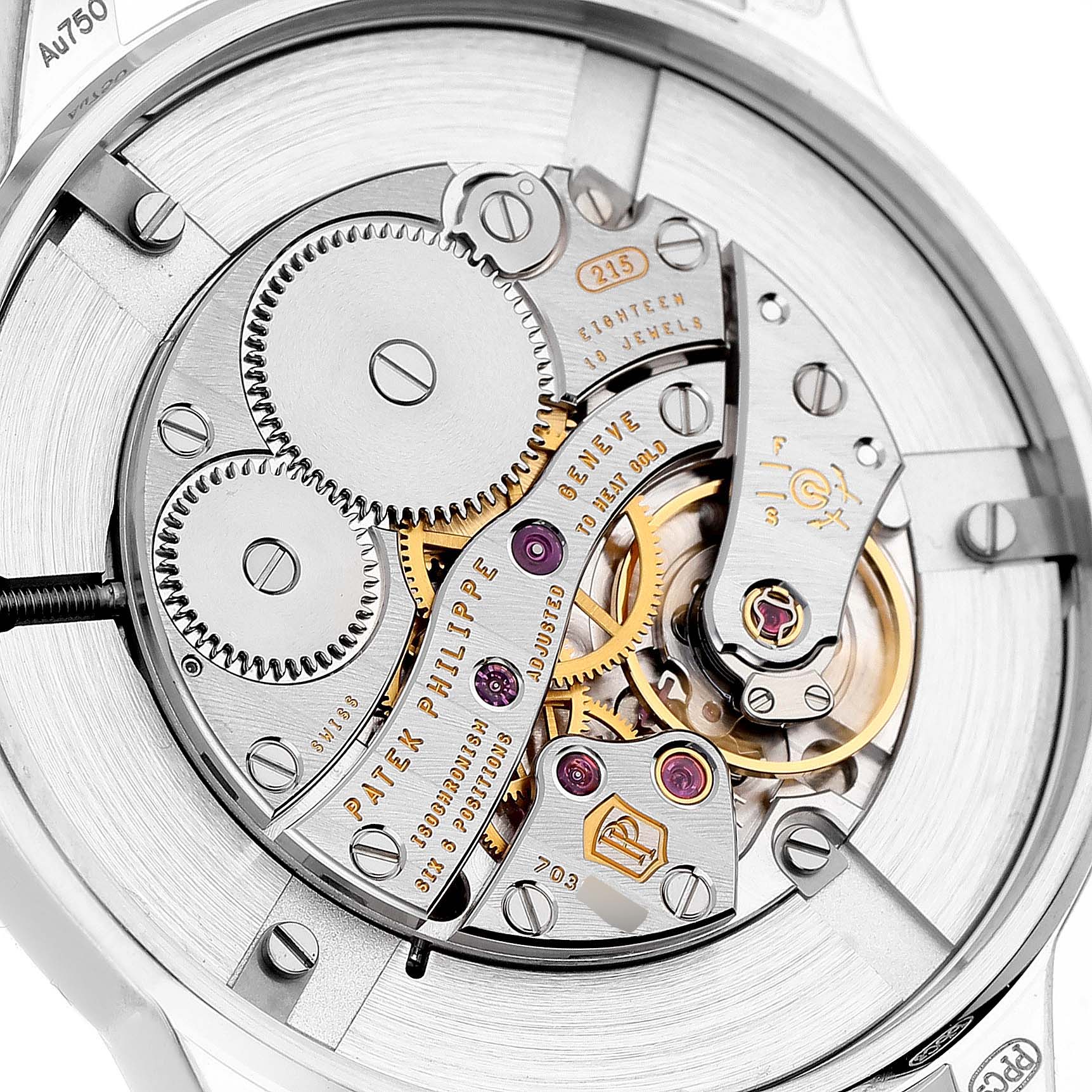The image shows the back of a Patek Philippe Calatrava 7122/200G-001 Women's White Gold White Dial watch, highlighting its intricate movement and components.