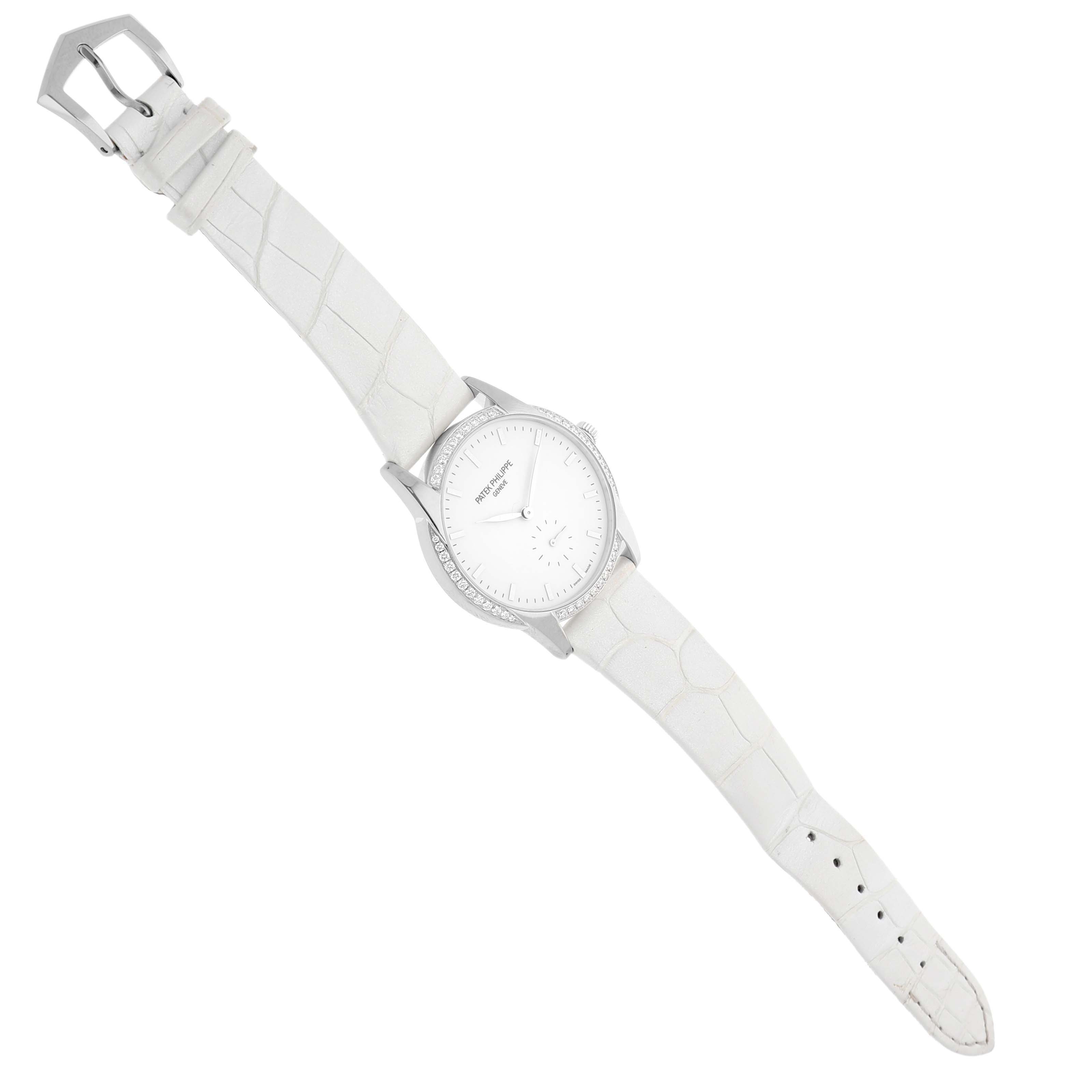 The Patek Philippe Calatrava 7122/200G-001 Women's White Gold White Dial watch is shown from a top view, displaying the face, bezel, case, and full leather strap.