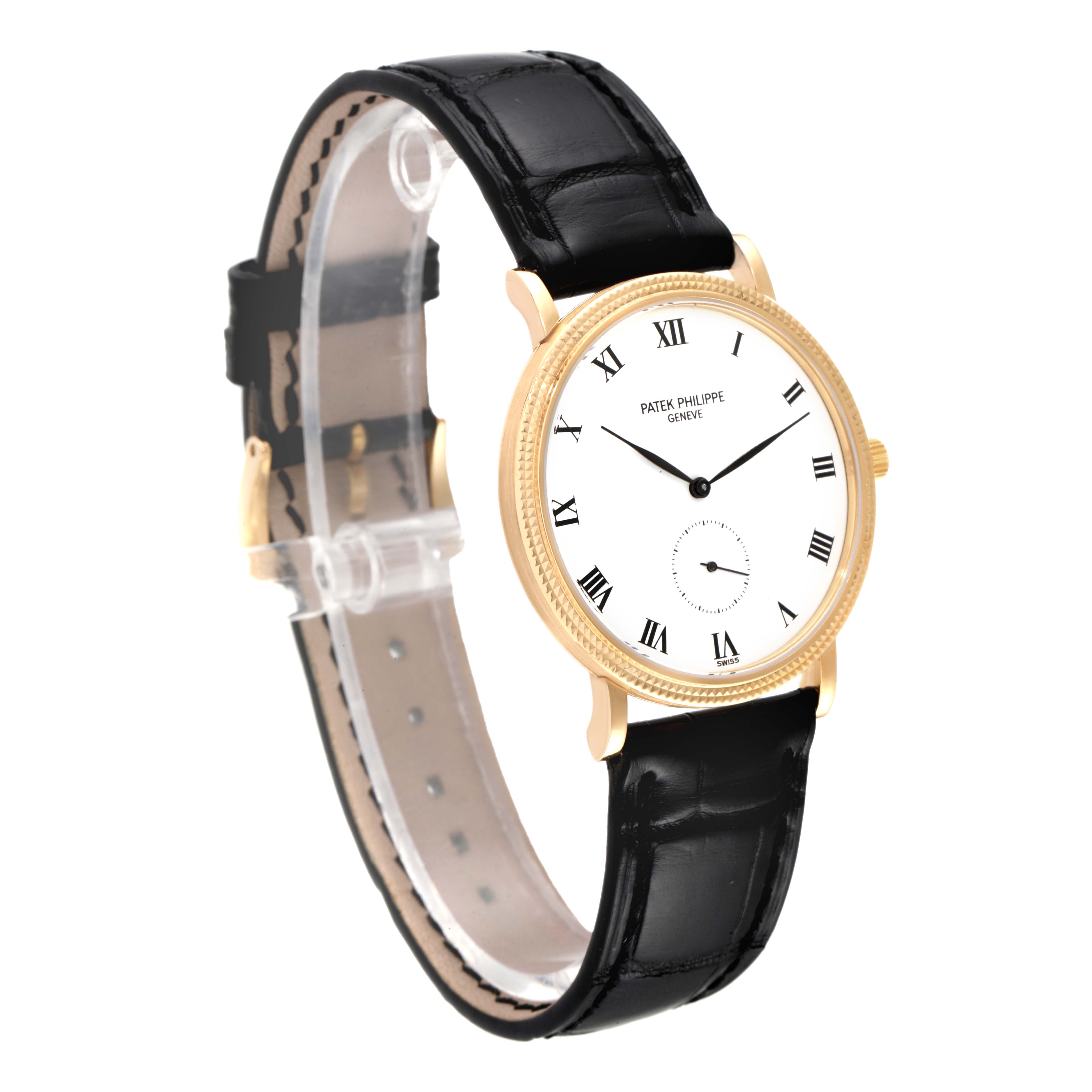 This image shows a side view of a Patek Philippe Calatrava 3919J Men's Yellow Gold White Dial 3919J Men's Yellow Gold White Dial watch, highlighting its gold case, white dial, and black leather strap.