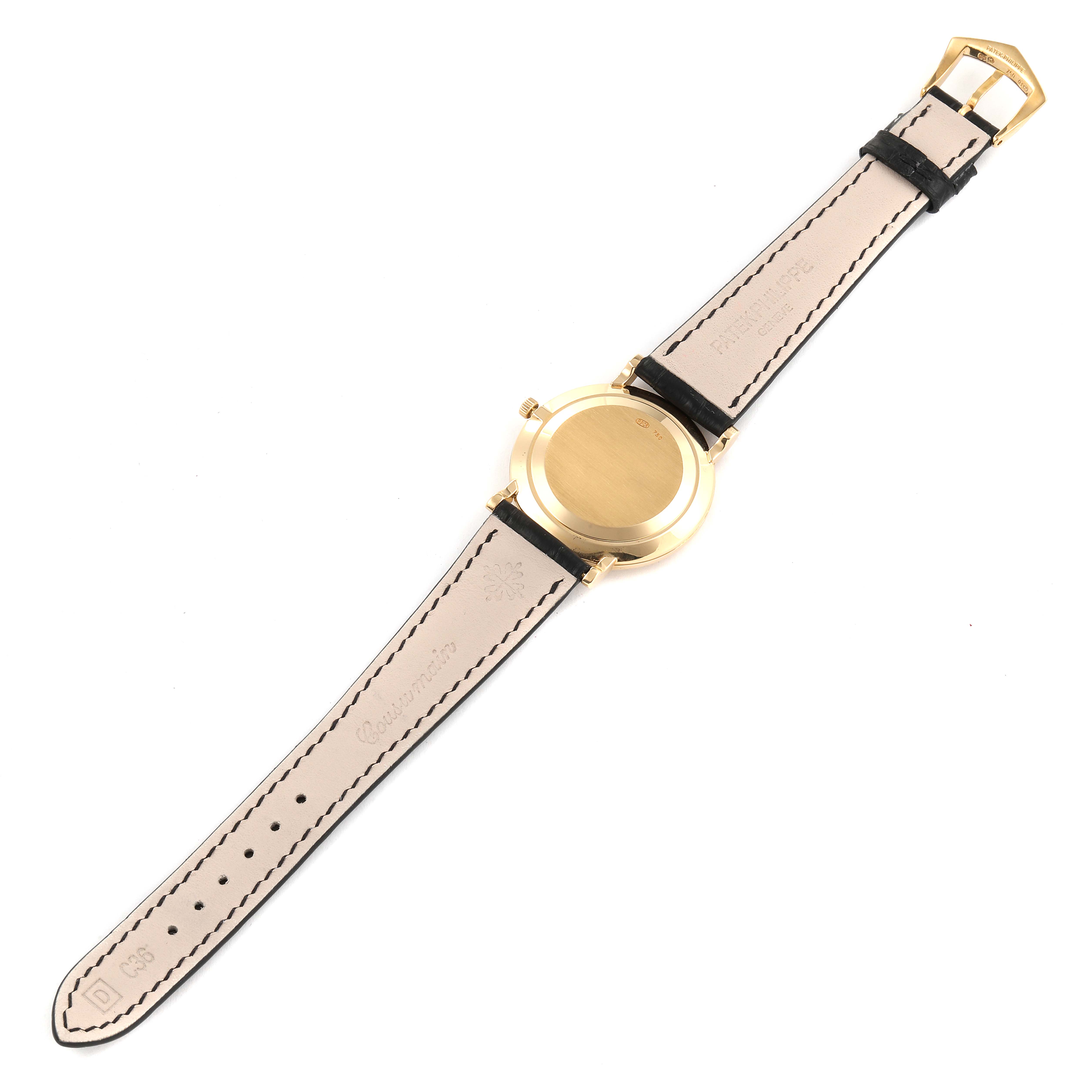 The image shows the back and strap of a Patek Philippe Calatrava 5022 Men's Yellow Gold White Dial 5022 Men's Yellow Gold White Dial watch from a top view.