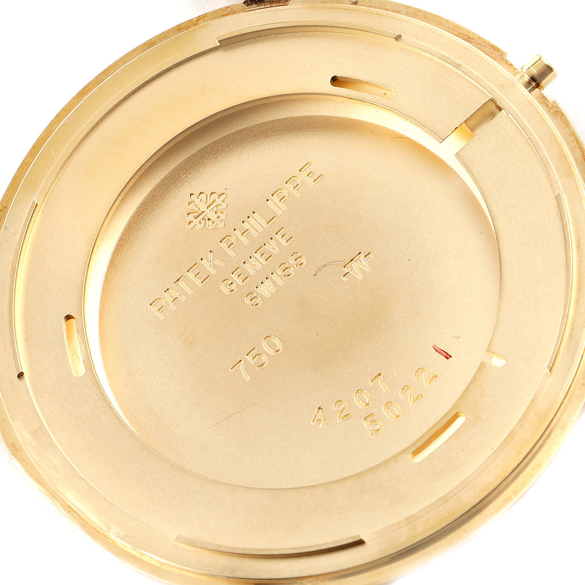 This image shows the interior case back of a Patek Philippe Calatrava 5022 Men's Yellow Gold White Dial 5022 Men's Yellow Gold White Dial watch, displaying brand engravings and specifications.