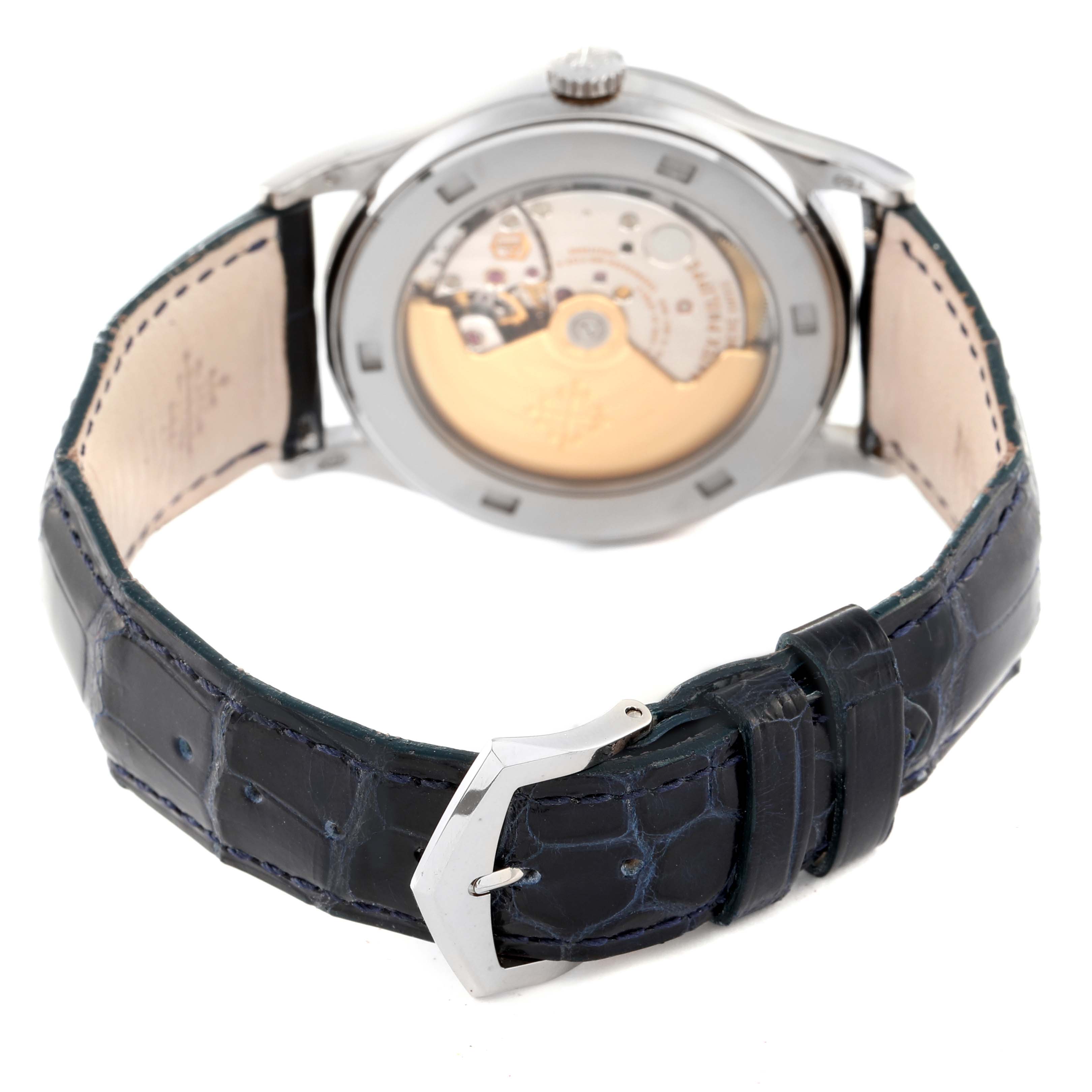 The image shows the back view of a Patek Philippe Calatrava 5296G Men's White Gold Silver Dial 5296G Men's White Gold Silver Dial watch, highlighting the movement and the leather strap with a buckle.