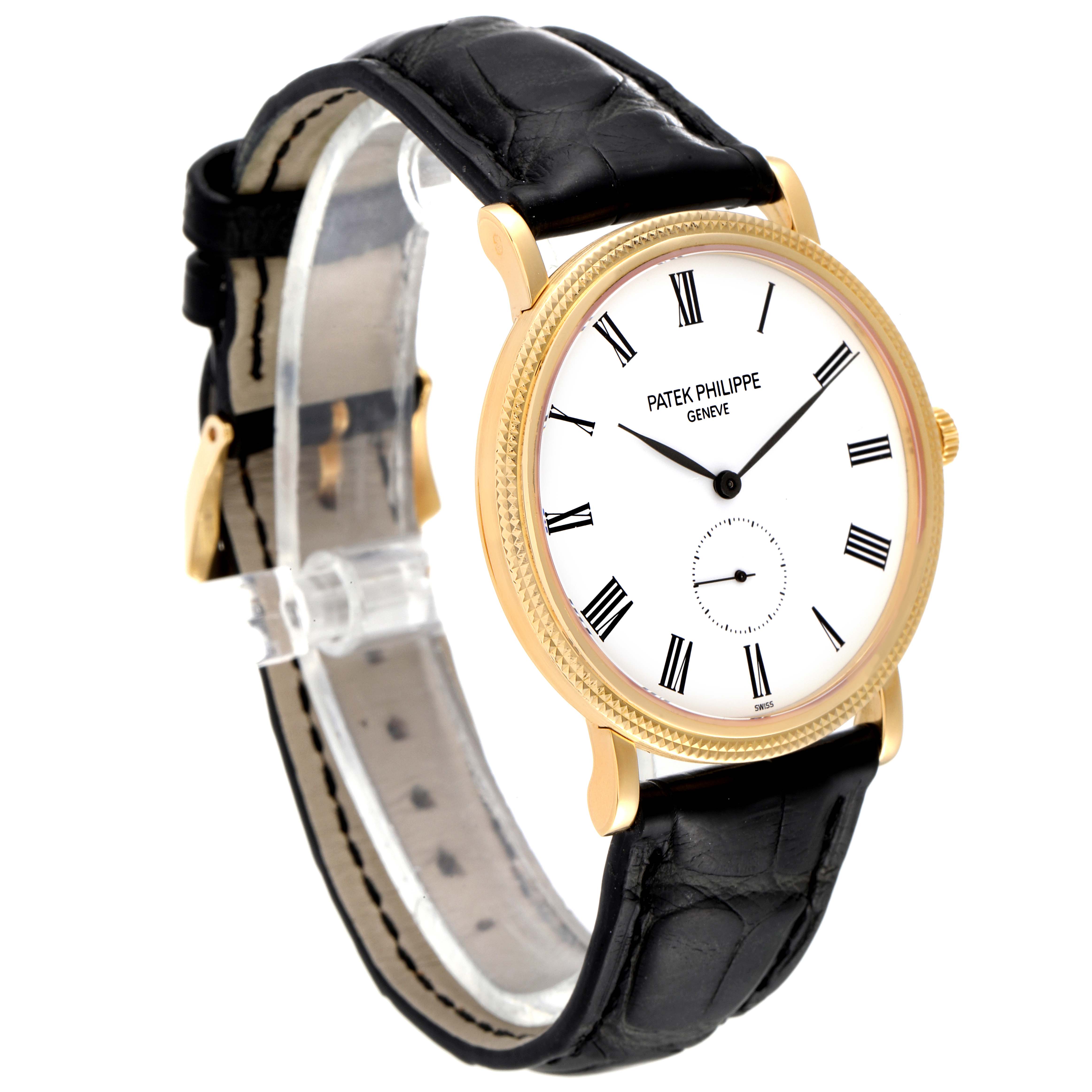 The Patek Philippe Calatrava 5119J Men's Yellow Gold White Dial 5119J Men's Yellow Gold White Dial watch is shown at a 3/4 angle, highlighting its dial, case, and leather strap.