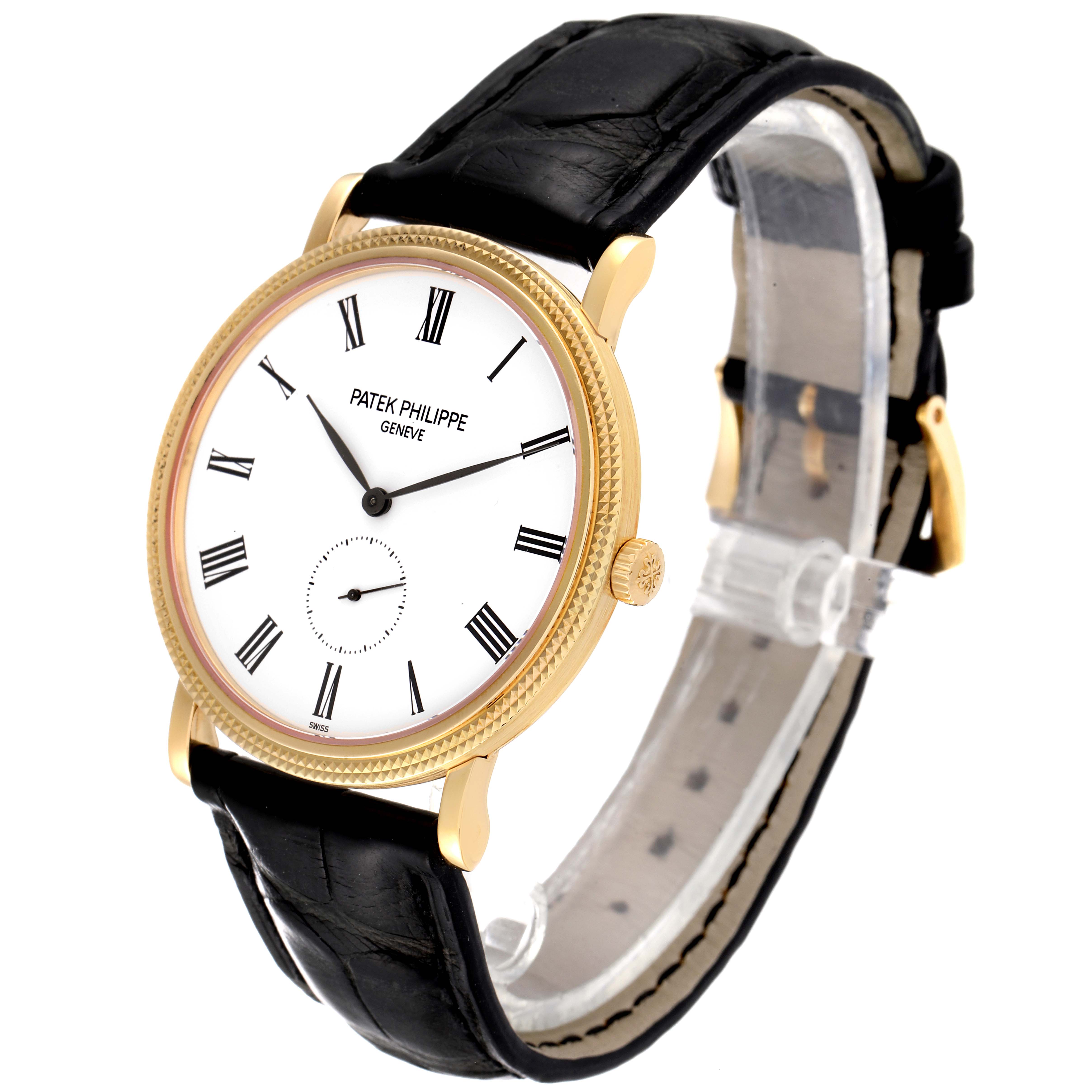 The image shows a Patek Philippe Calatrava 5119J Men's Yellow Gold White Dial 5119J Men's Yellow Gold White Dial watch at an angle displaying the dial, case, bezel, crown, and leather strap.